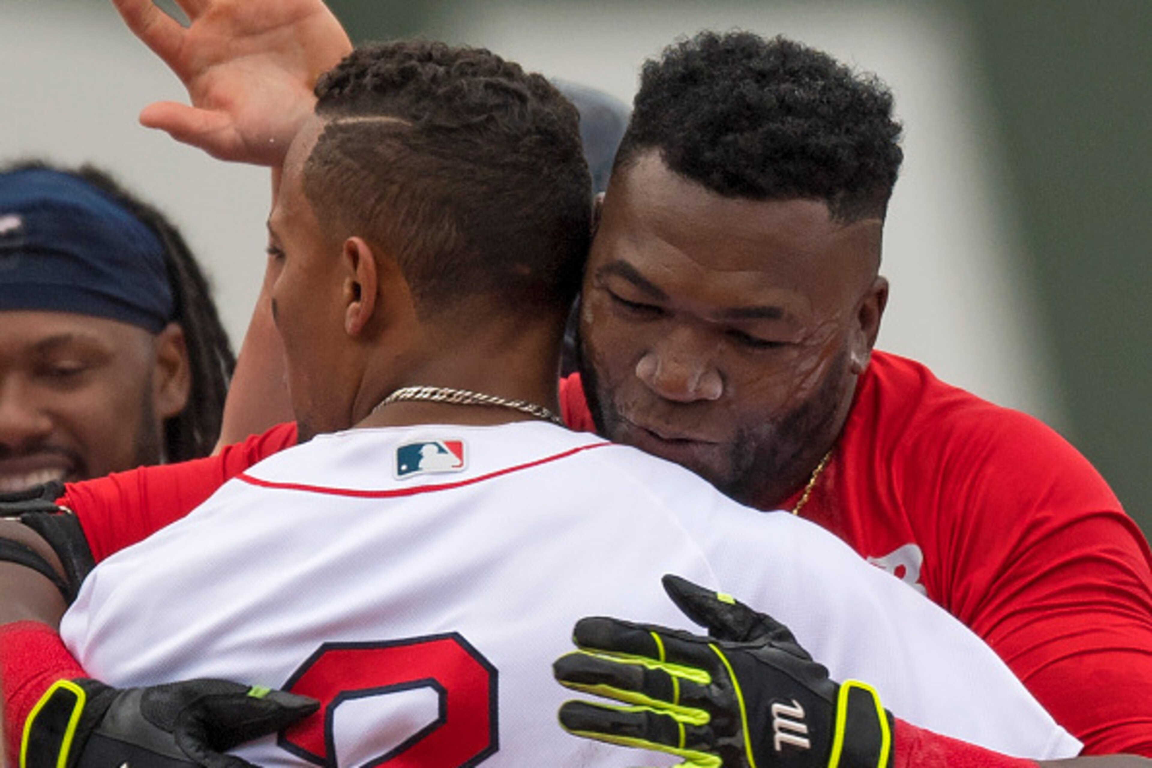 BOSTON, MA - MAY 14:  David Ortiz #34 hugs Xander Bogaerts #2 after hitting a game winning double against  the Houston Astros in the eleventh inning on May 14, 2016  at Fenway Park in Boston, Massachusetts. (Photo by Michael Ivins/Boston Red Sox/Getty Ima