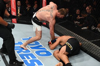 CURITIBA, BRAZIL - MAY 14:  (L-R) Stipe Miocic punches Fabricio Werdum of Brazil in their UFC heavyweight championship bout during the UFC 198 event at Arena da Baixada stadium on May 14, 2016 in Curitiba, Parana, Brazil.  (Photo by Josh Hedges/Zuffa LLC/