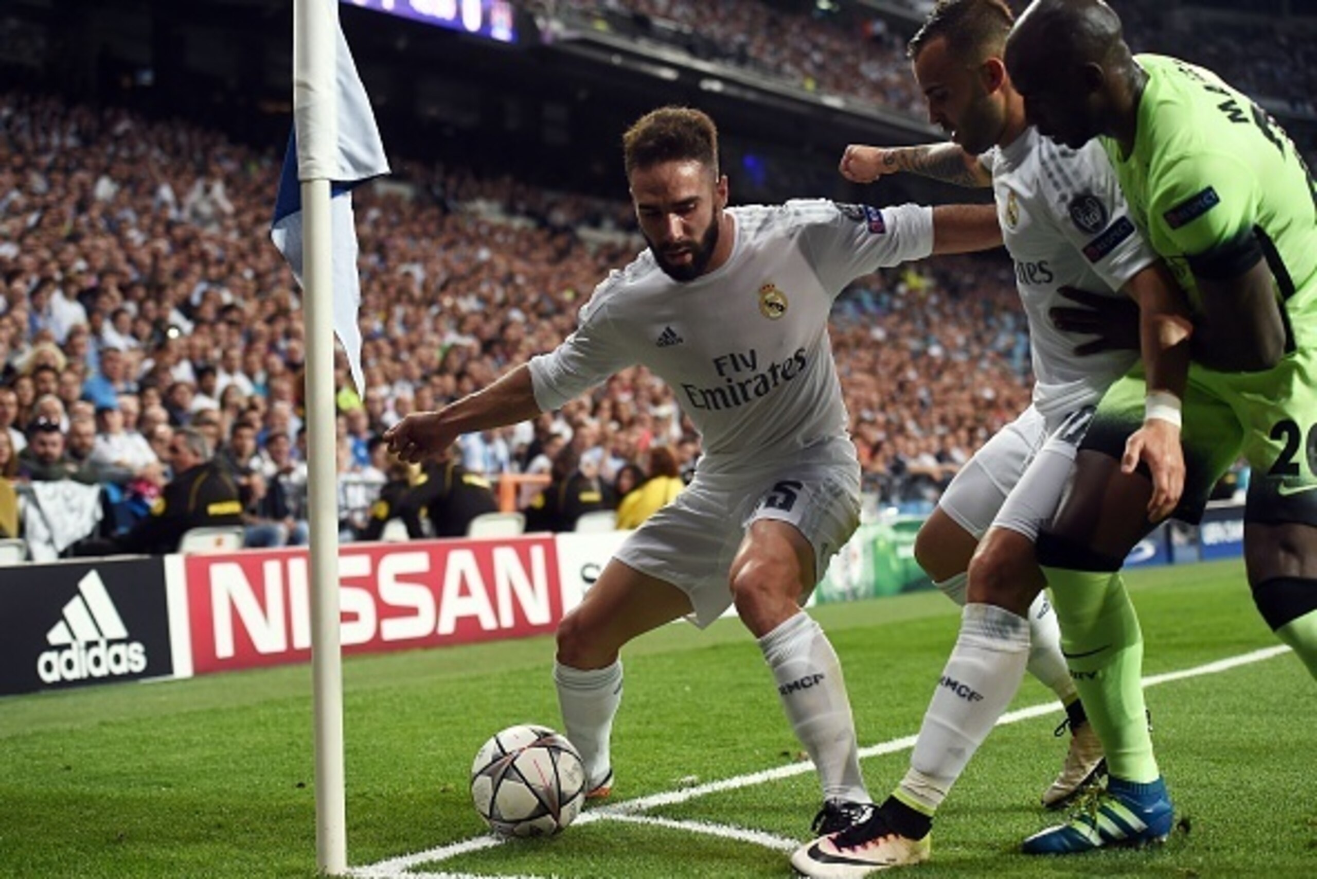 Real Madrid's defender Dani Carvajal (L) and Real Madrid's forward Jese Rodriguez (C) vies with Manchester City's French defender Eliaquim Mangala during the UEFA Champions League semi-final second leg football match Real Madrid CF vs Manchester City FC a Real Madrid's defender Dani Carvajal (L) and Real Madrid's forward Jese Rodriguez (C) vies with Manchester City's French defender Eliaquim Mangala during the UEFA Champions League semi-final second leg football match Real Madrid CF vs Manchester City FC a