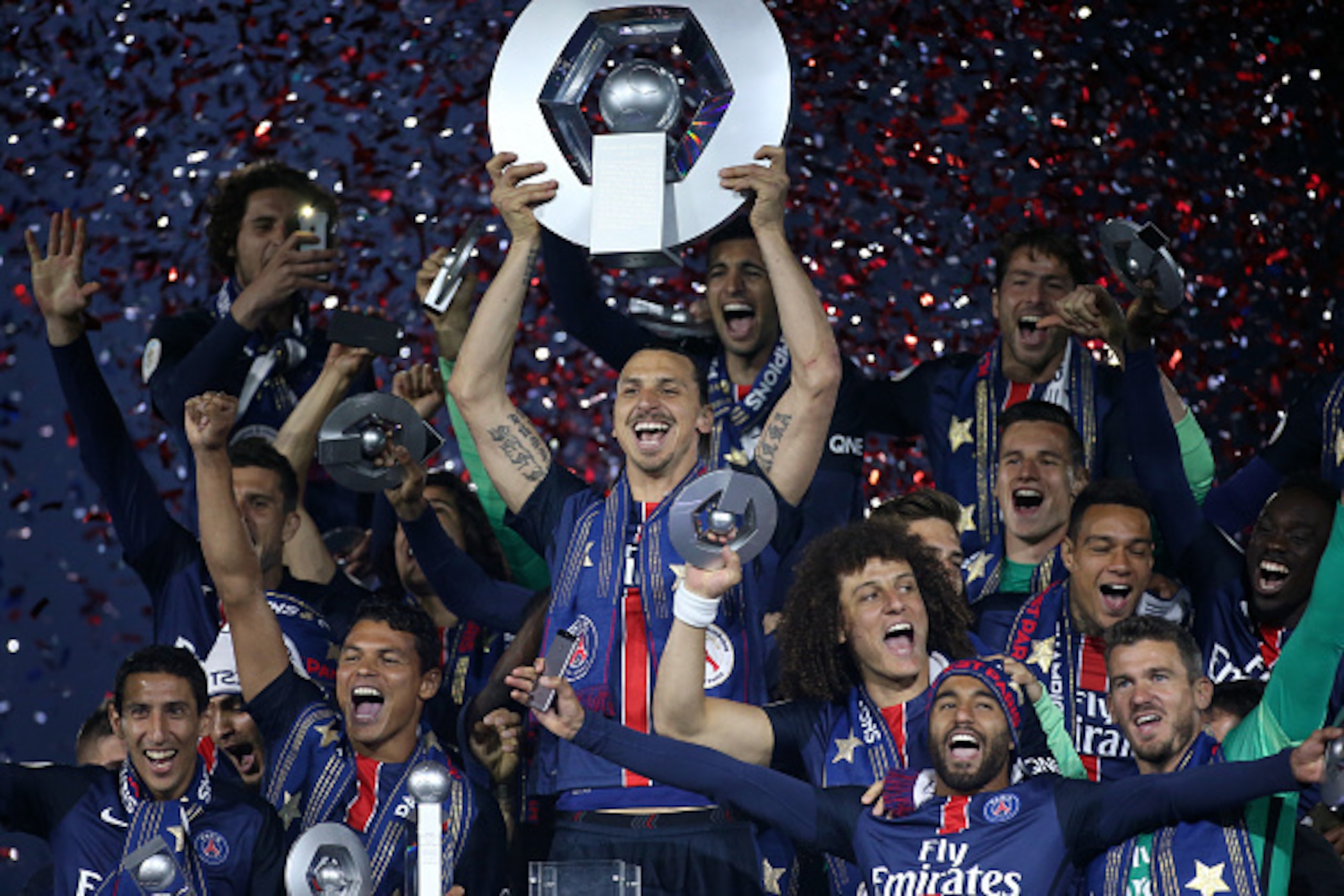 PARIS, FRANCE - MAY 14: Zlatan Ibrahimovic of PSG celebrates with teammates winning the French Ligue 1 championship during the trophy ceremony following the French Ligue 1 match between Paris Saint-Germain (PSG) and FC Nantes at Parc des Princes stadium o