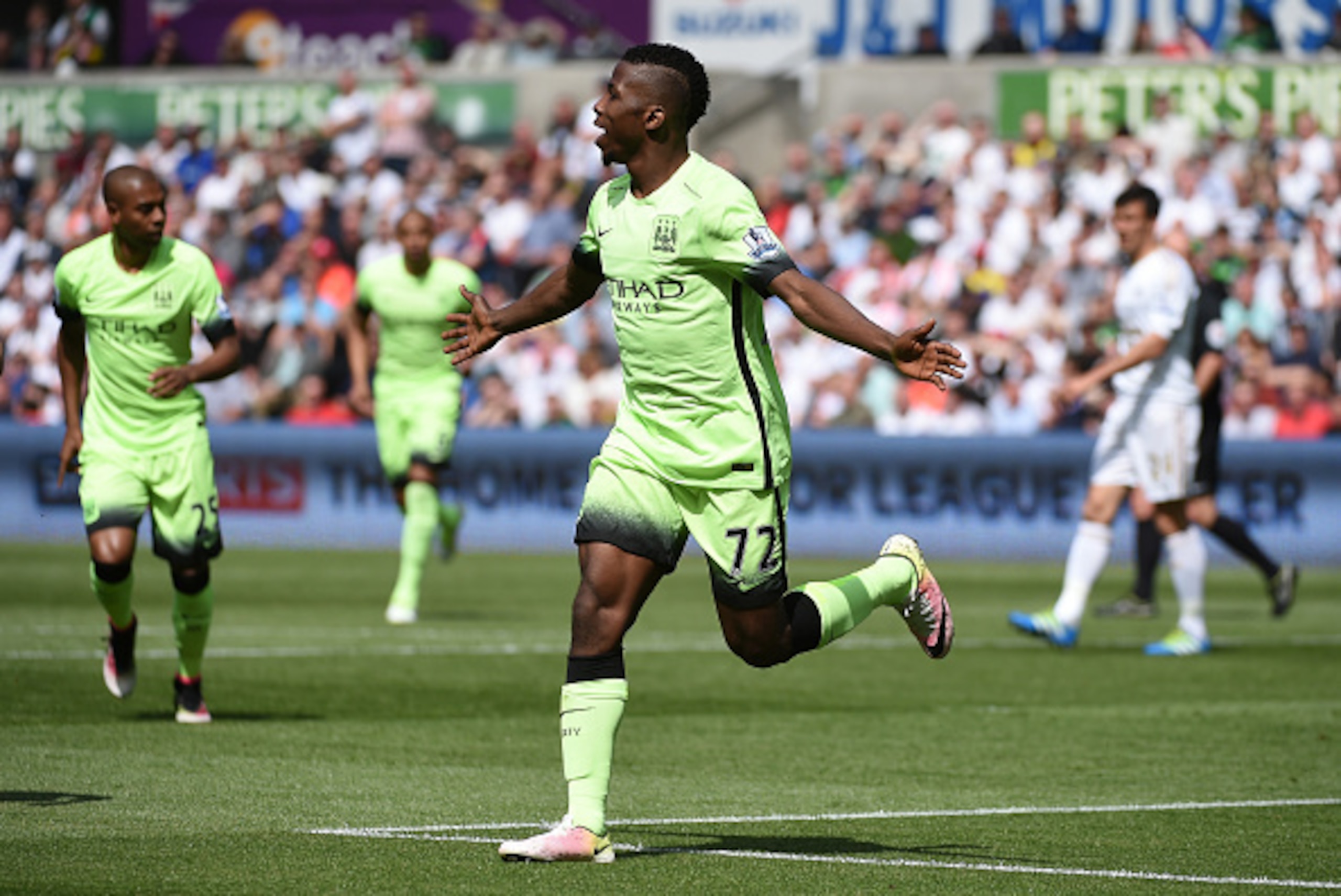 SWANSEA, WALES - MAY 15:  Kelechi Iheanacho of Manchester City celebrates scoring his team's first goal during the Barclays Premier League match between Swansea City and Manchester City at the Liberty Stadium on May 15, 2016 in Swansea, Wales.  (Photo by 