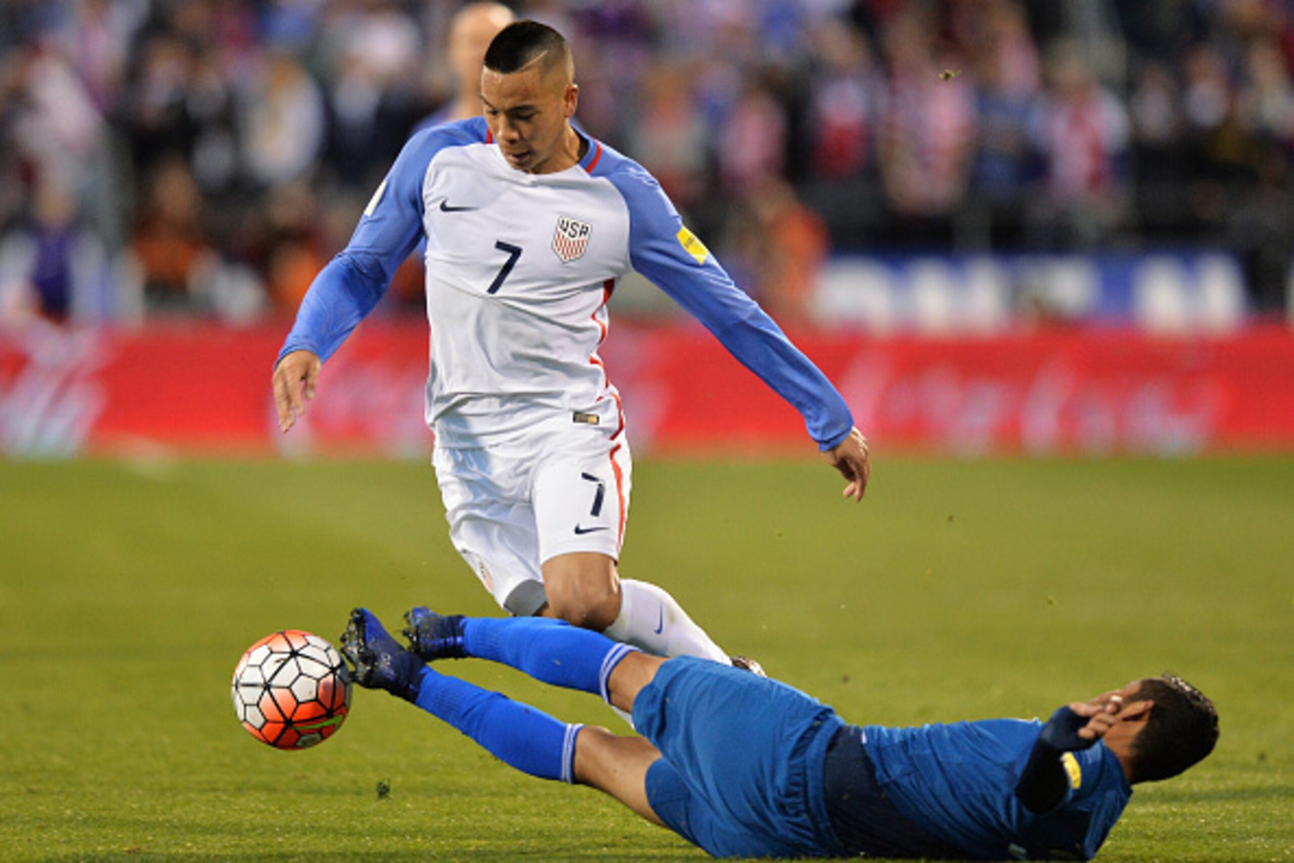 COLUMBUS, OH - MARCH 29:  Cristian Jimenez #3 of Guatemala fouls Bobby Wood #7 of the United States Men's National Team in the first half earning a yellow card during the FIFA 2018  World Cup qualifier on March 29, 2016 at MAPFRE Stadium in Columbus, Ohio