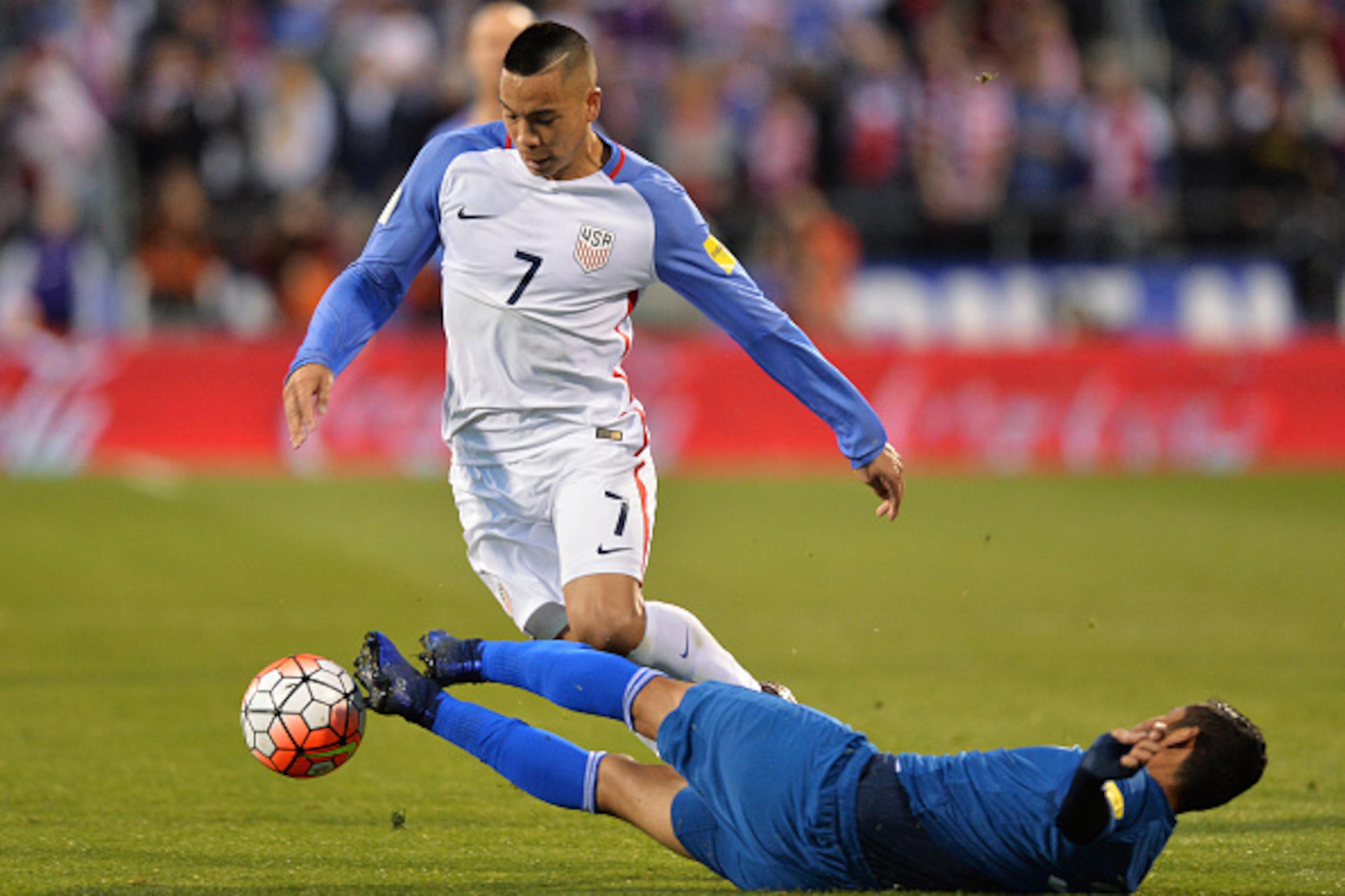 COLUMBUS, OH - MARCH 29:  Cristian Jimenez #3 of Guatemala fouls Bobby Wood #7 of the United States Men's National Team in the first half earning a yellow card during the FIFA 2018  World Cup qualifier on March 29, 2016 at MAPFRE Stadium in Columbus, Ohio