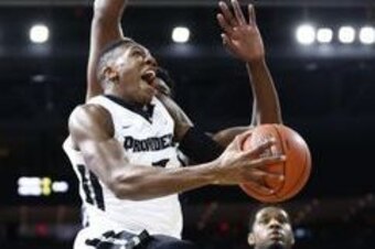 Feb 13, 2016; Providence, RI, USA; Providence Friars guard Kris Dunn (3) shoots the ball against Georgetown Hoyas forward Marcus Derrickson (back) during the first half at Dunkin Donuts Center. Mandatory Credit: Mark L. Baer-USA TODAY Sports