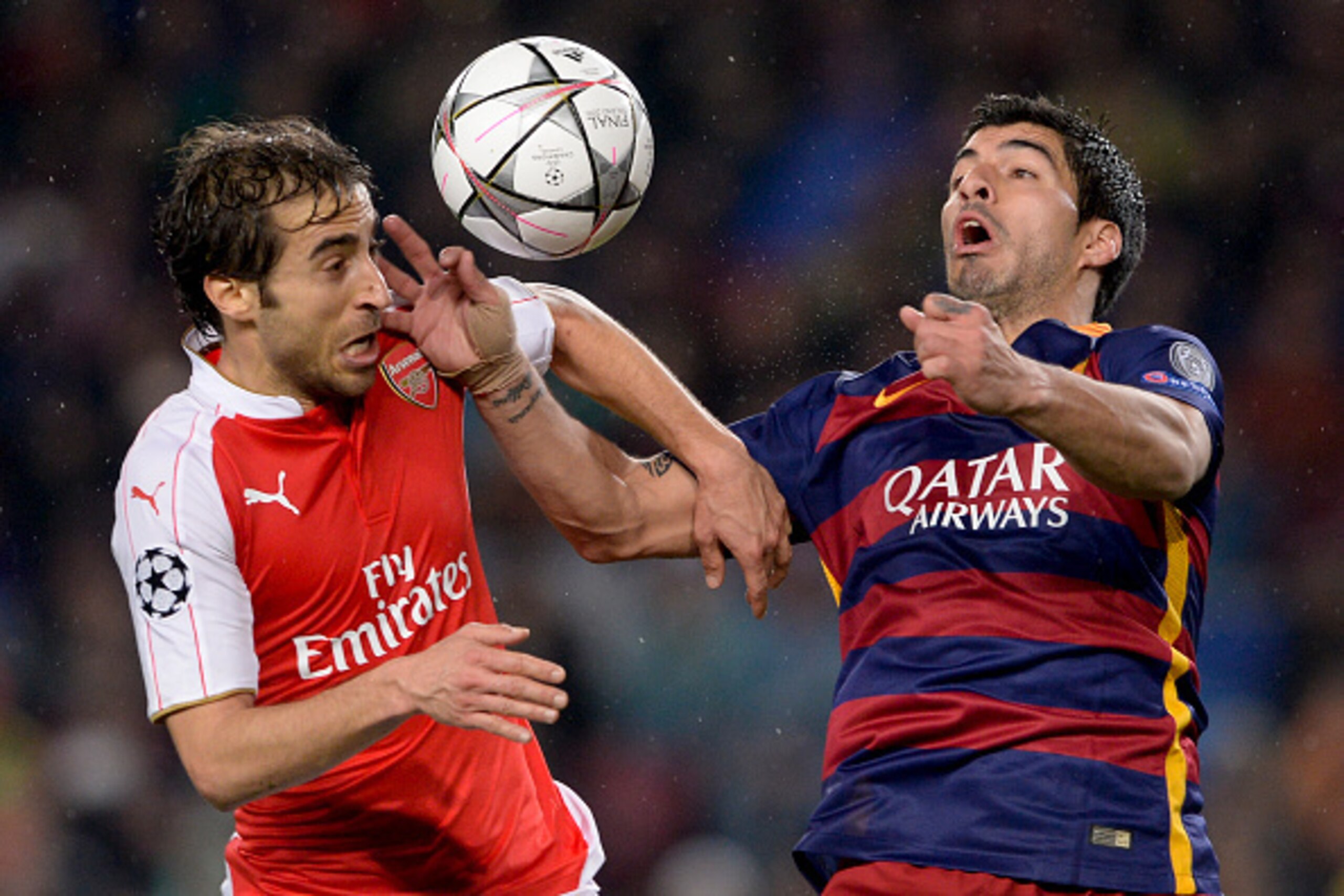 Arsenal's French midfielder Mathieu Flamini (L) vies with Barcelona's Uruguayan forward Luis Suarez during the UEFA Champions League Round of 16 second leg football match FC Barcelona vs Arsenal FC at the Camp Nou stadium in Barcelona on March 16, 2016. Arsenal's French midfielder Mathieu Flamini (L) vies with Barcelona's Uruguayan forward Luis Suarez during the UEFA Champions League Round of 16 second leg football match FC Barcelona vs Arsenal FC at the Camp Nou stadium in Barcelona on March 16, 2016.
