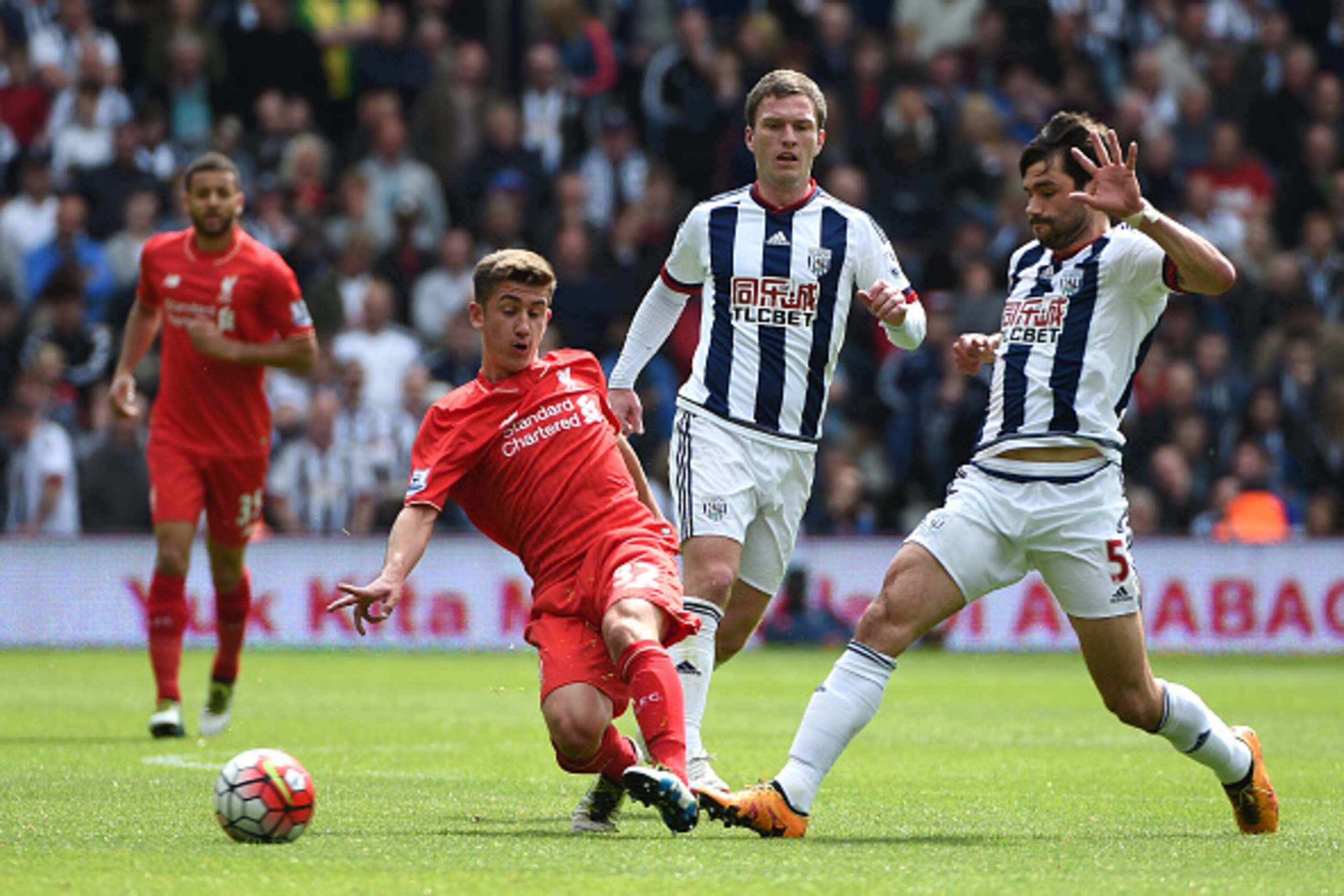 WEST BROMWICH, ENGLAND - MAY 15: Cameron Brannagan of Liverpool and Claudio Yacob of West Bromwich Albion compete for the ball during the Barclays Premier League match between West Bromwich Albion and Liverpool at The Hawthorns on May 15, 2016 in West Bro