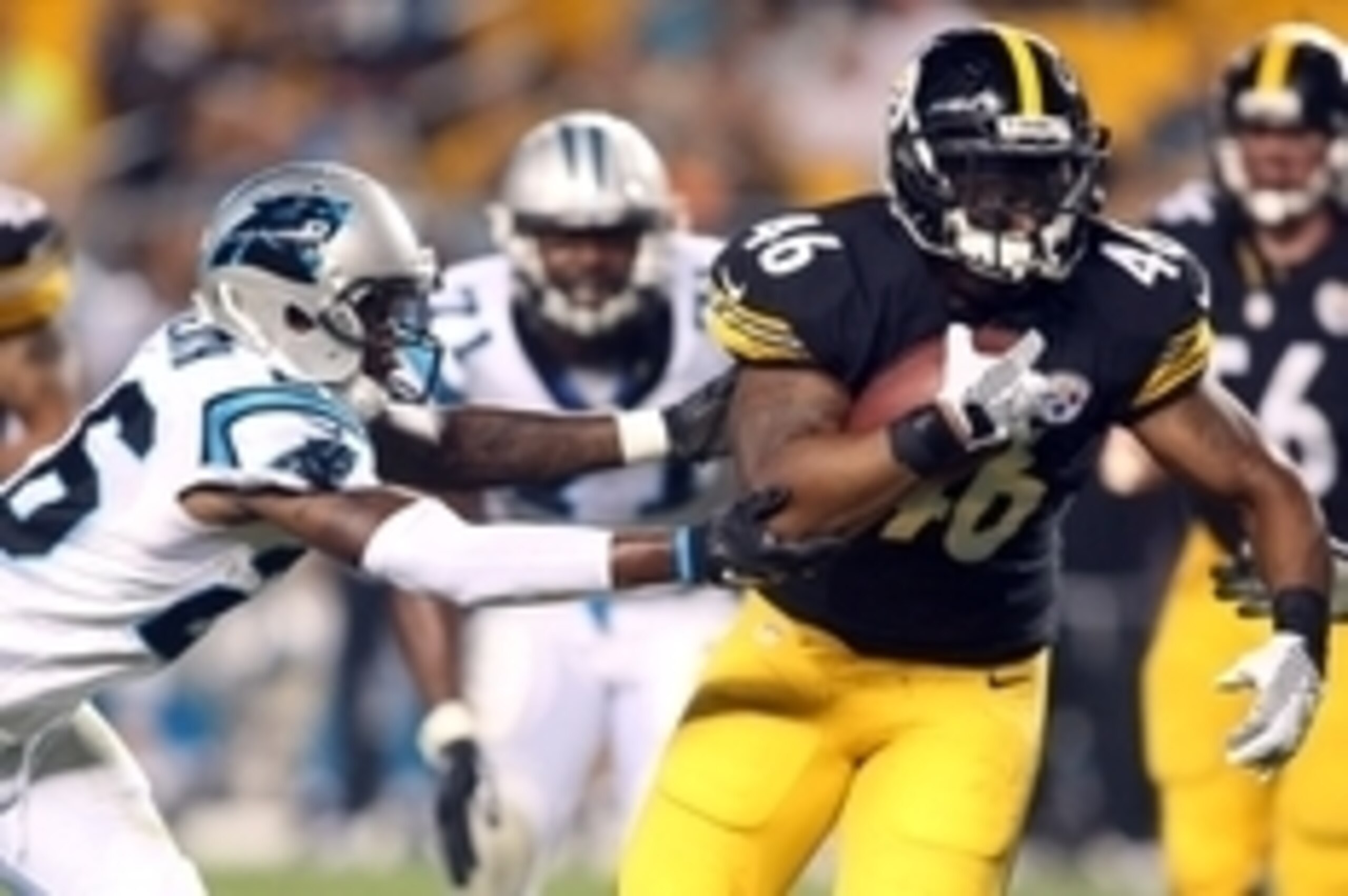 Sep 3, 2015; Pittsburgh, PA, USA; Pittsburgh Steelers fullback Will Johnson (46) rushes the ball against Carolina Panthers defensive back T.J. Heath (26) during the fourth quarter at Heinz Field. Carolina won 23-6. Mandatory Credit: Charles LeClaire-USA T