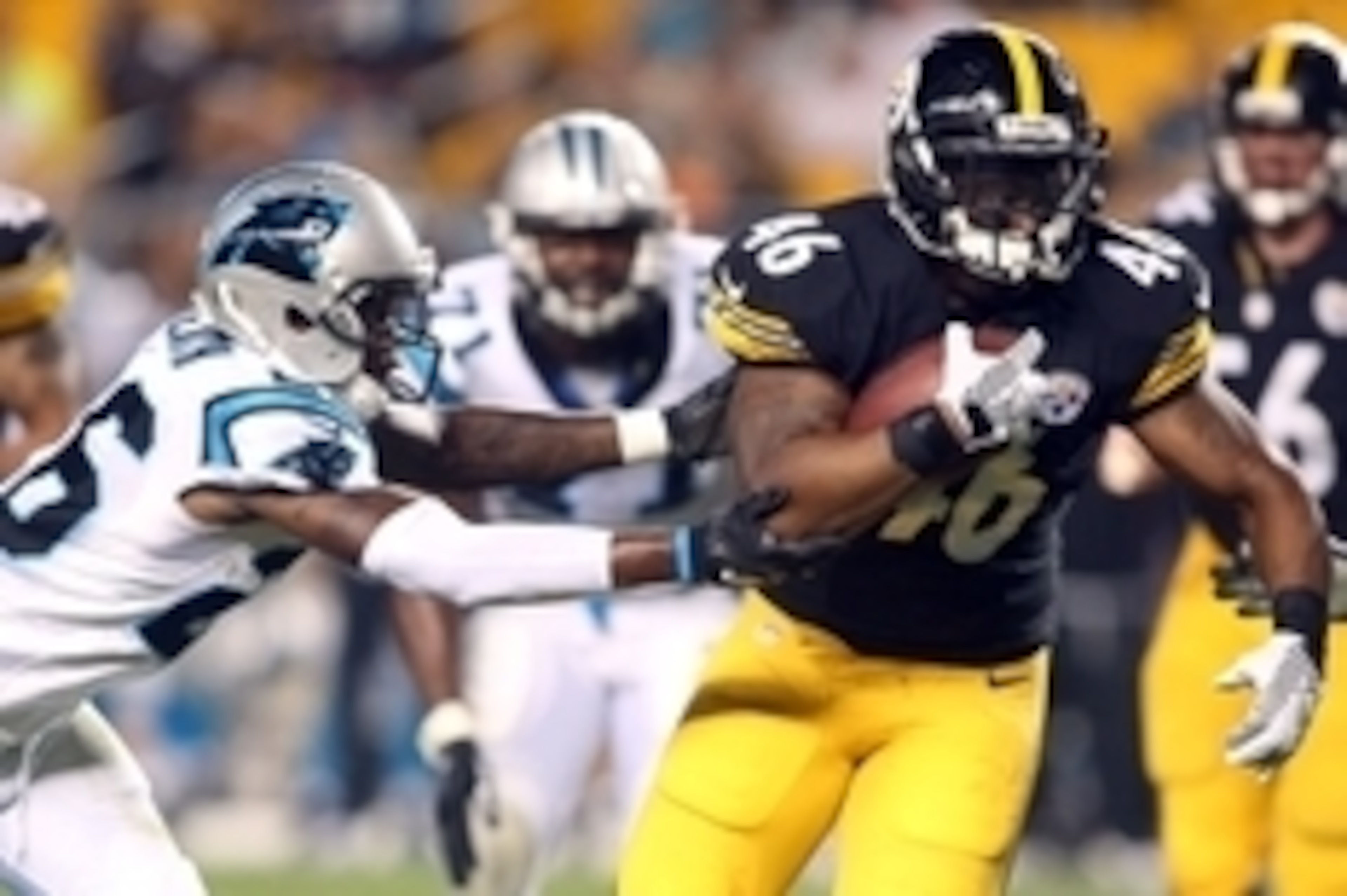 Sep 3, 2015; Pittsburgh, PA, USA; Pittsburgh Steelers fullback Will Johnson (46) rushes the ball against Carolina Panthers defensive back T.J. Heath (26) during the fourth quarter at Heinz Field. Carolina won 23-6. Mandatory Credit: Charles LeClaire-USA T