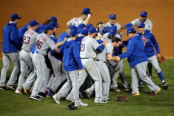 CHICAGO, IL - OCTOBER 21:  The New York Mets celebrate after defeating the Chicago Cubs in game four of the 2015 MLB National League Championship Series at Wrigley Field on October 21, 2015 in Chicago, Illinois.  The Mets defeated the Cubs with a score of