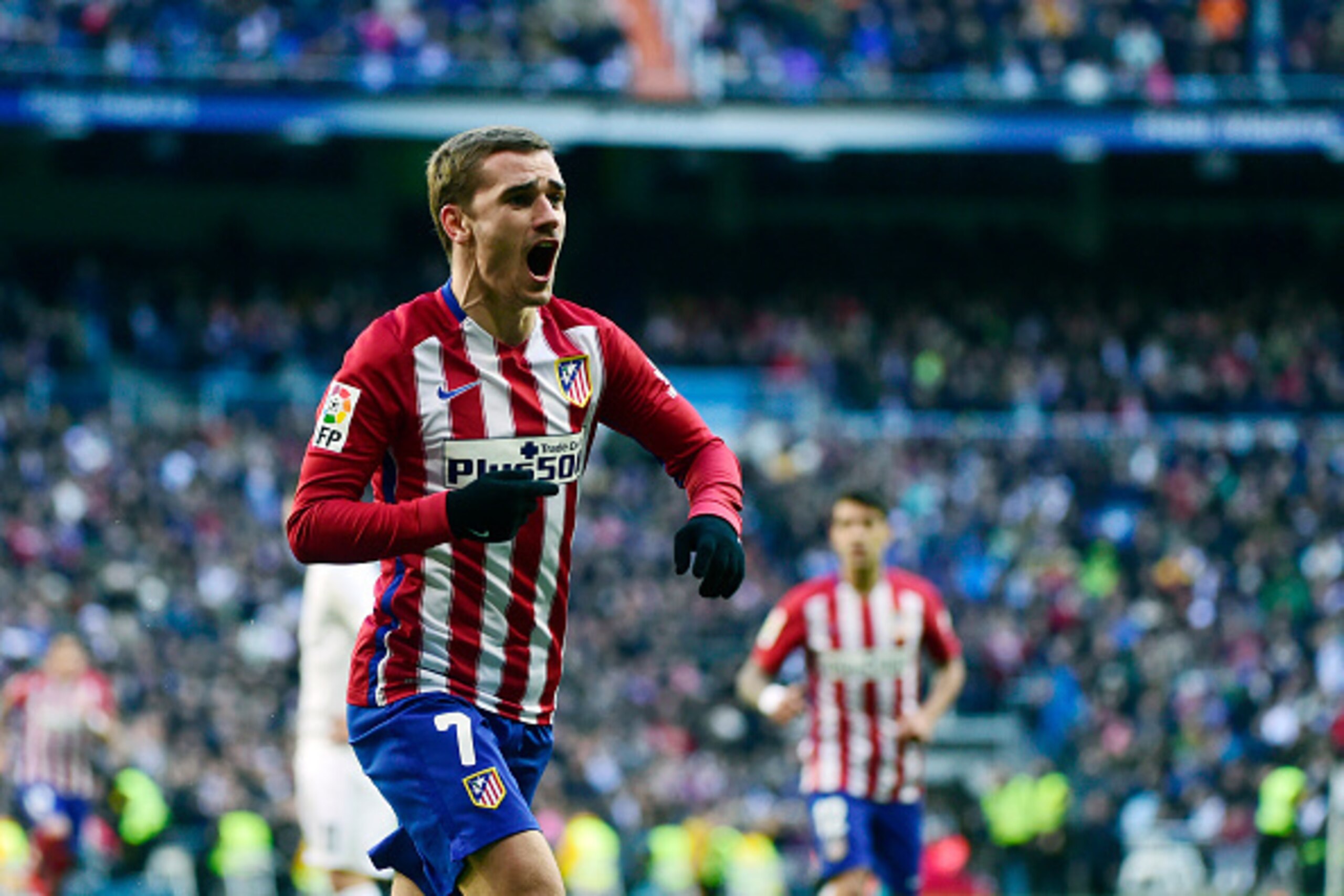 Atletico Madrid's French forward Antoine Griezmann celebrates a goal during the Spanish league football match Real Madrid CF vs Club Atletico de Madrid at the Santiago Bernabeu stadium in Madrid on February 27, 2016. / AFP / PIERRE-PHILIPPE MARCOU        
