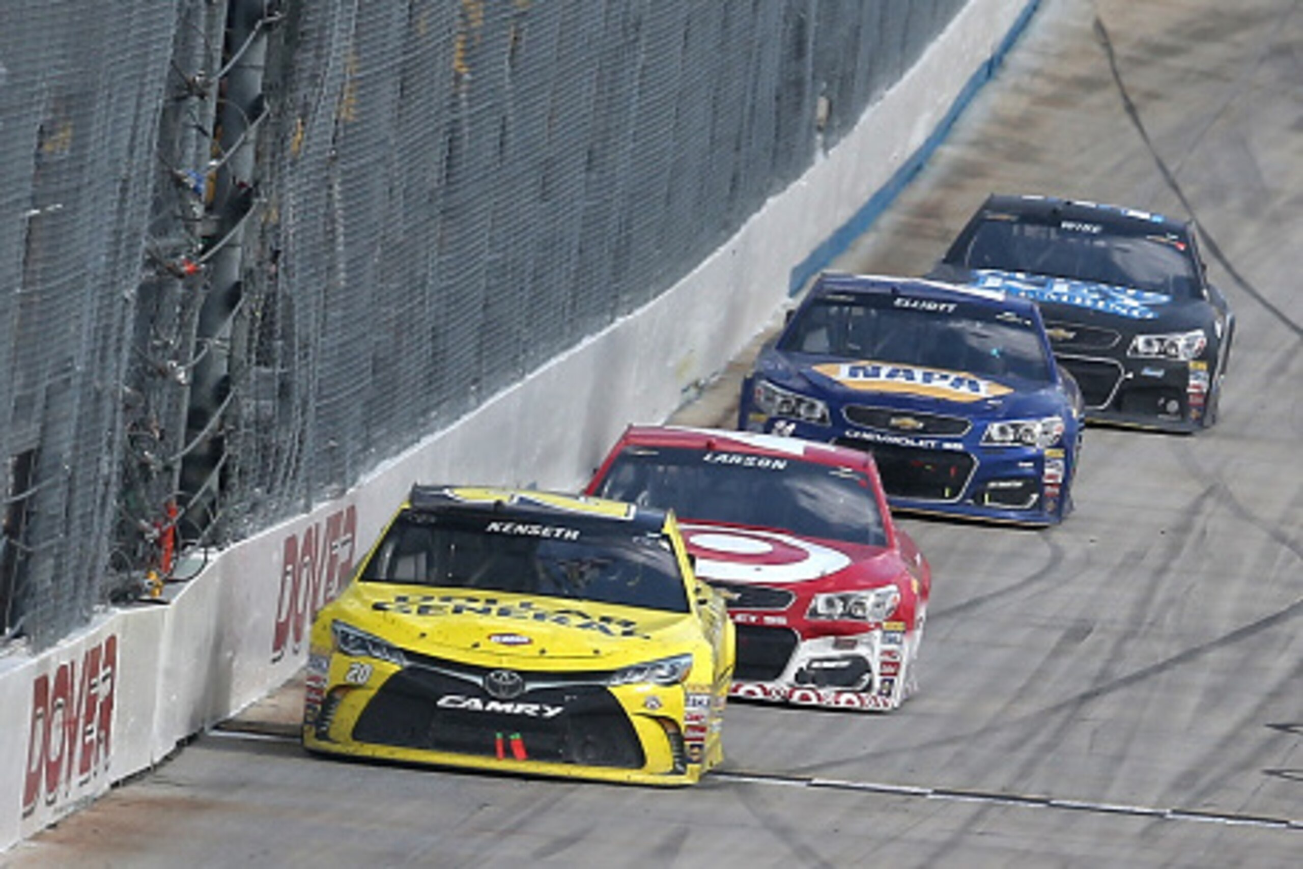 DOVER, DE - MAY 15: Matt Kenseth, driver of the #20 Dollar General Toyota, takes the checkered flag during the NASCAR Sprint Cup Series AAA 400 Drive for Autism at Dover International Speedway on May 15, 2016 in Dover, Delaware.  (Photo by Sean Gardner/Ge