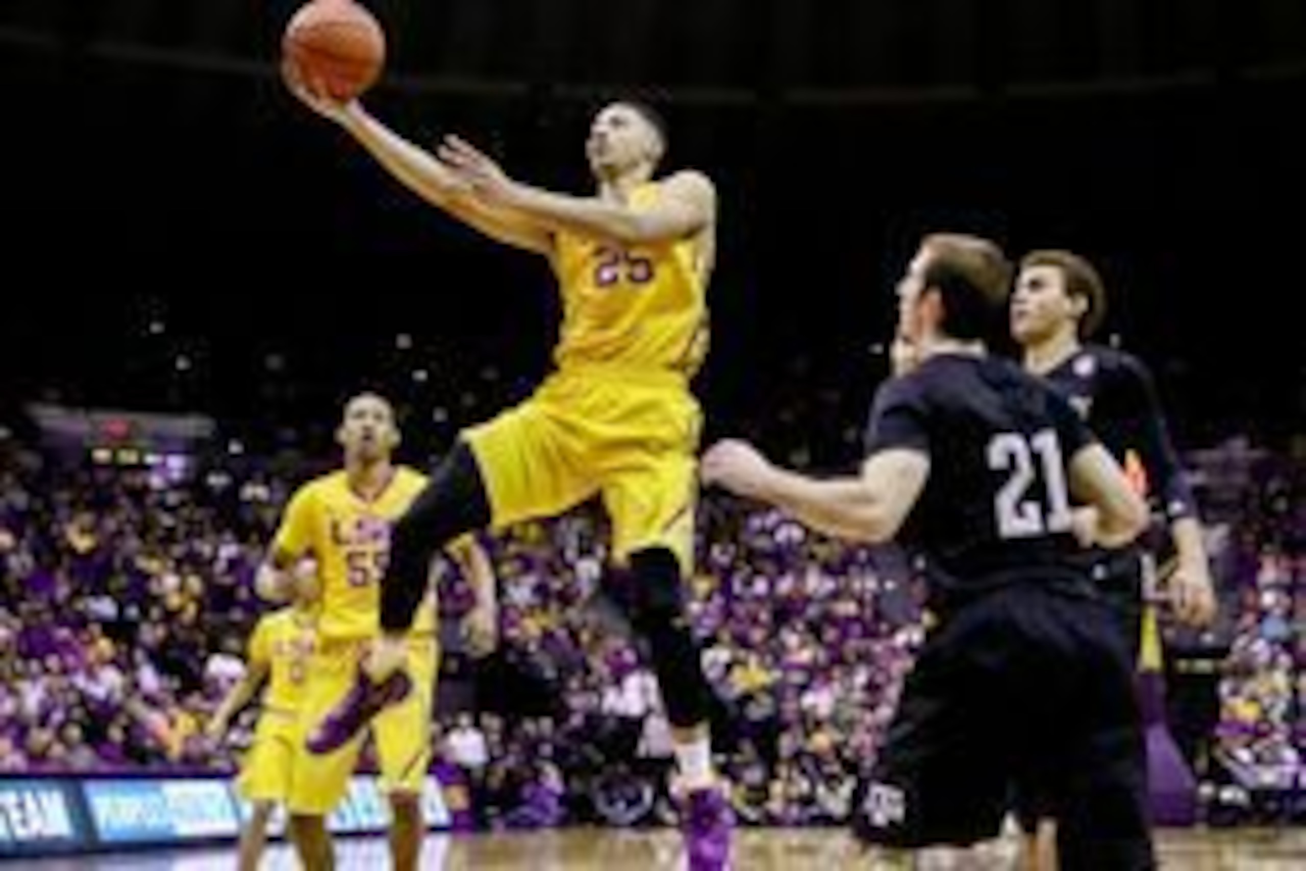 Feb 13, 2016; Baton Rouge, LA, USA; LSU Tigers forward Ben Simmons (25) shoots over Texas A&M Aggies guard Alex Caruso (21) during the first half of a game at the Pete Maravich Assembly Center. Mandatory Credit: Derick E. Hingle-USA TODAY Sports