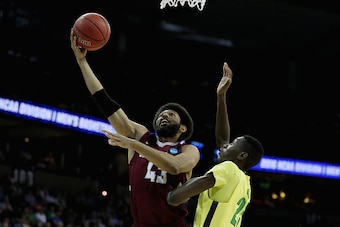 SPOKANE, WA - MARCH 20:  DeAndre Bembry #43 of the Saint Joseph's Hawks shoots against Chris Boucher #25 of the Oregon Ducks in the second half during the second round of the 2016 NCAA Men's Basketball Tournament at Spokane Veterans Memorial Arena on Marc