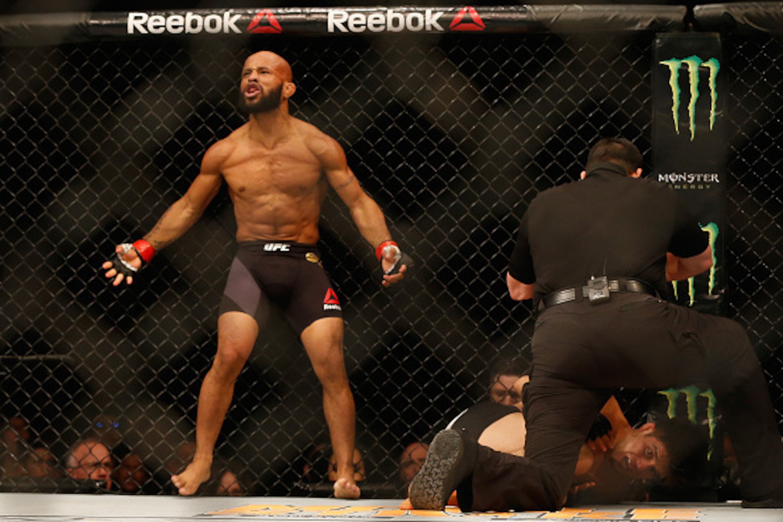 LAS VEGAS, NV - APRIL 23: Demetrious Johnson celebrates his TKO victory over Henry Cejudo in their flyweight championship bout during the UFC 197 event inside MGM Grand Garden Arena on April 23, 2016 in Las Vegas, Nevada. (Photo by Christian Petersen/Zu LAS VEGAS, NV - APRIL 23: Demetrious Johnson celebrates his TKO victory over Henry Cejudo in their flyweight championship bout during the UFC 197 event inside MGM Grand Garden Arena on April 23, 2016 in Las Vegas, Nevada. (Photo by Christian Petersen/Zu