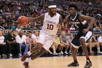 ORLANDO, FL - MARCH 12: Mark Williams #10 of the Temple Owls drives on Daniel Hamilton #5 of the Connecticut Huskies during a semifinal game of the 2016 AAC Basketball Tournament at Amway Center on March 12, 2016 in Orlando, Florida.  (Photo by Mike Ehrma