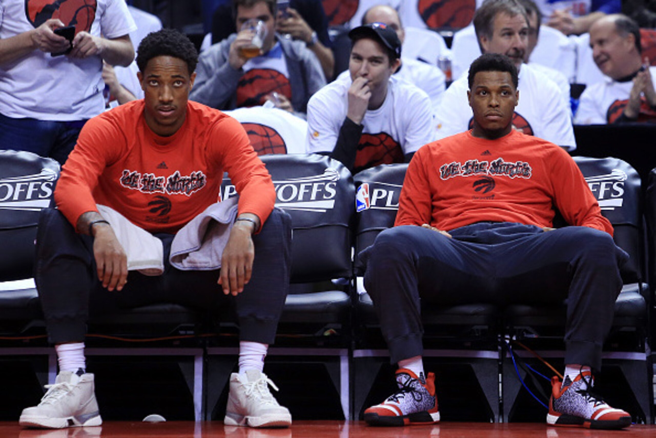 TORONTO, ON - MAY 15:  DeMar DeRozan #10 and Kyle Lowry #7 of the Toronto Raptors watch from the bench during warmup prior to Game Seven of the Eastern Conference Quarterfinals against the Miami Heat during the 2016 NBA Playoffs at the Air Canada Centre o