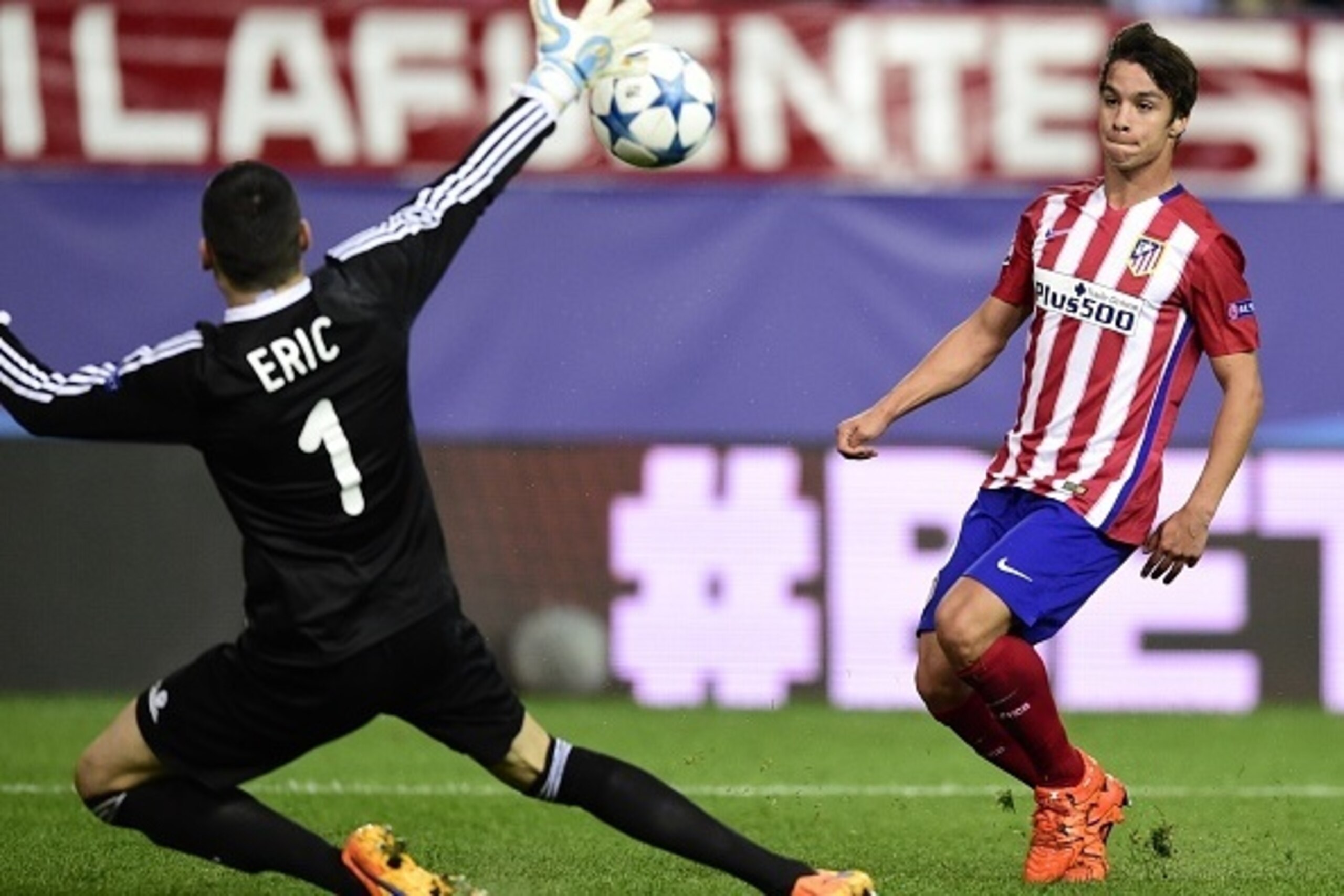 Atletico Madrid's midfielder Oliver Torres (L) shoots to score in front of Astana's Serbian goalkeeper Nenad Erich during the UEFA Champions League group C football match Club Atletico de Madrid vs FC Astana at the Vicente Calderon stadium in Madrid on Oc Atletico Madrid's midfielder Oliver Torres (L) shoots to score in front of Astana's Serbian goalkeeper Nenad Erich during the UEFA Champions League group C football match Club Atletico de Madrid vs FC Astana at the Vicente Calderon stadium in Madrid on Oc