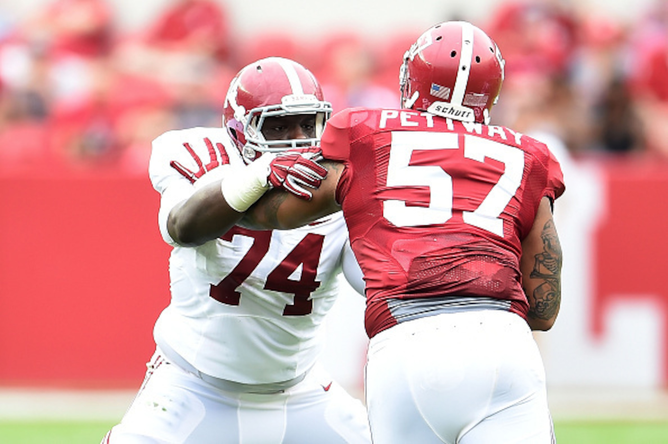 TUSCALOOSA, AL - APRIL 18:  Cam Robinson #74 of the White team works against D.J. Pettway #57 of the Crimson team during the University of Alabama Crimson Tide A-day spring game at Bryant-Denny Stadium on April 18, 2015 in Tuscaloosa, Alabama.  (Photo by 