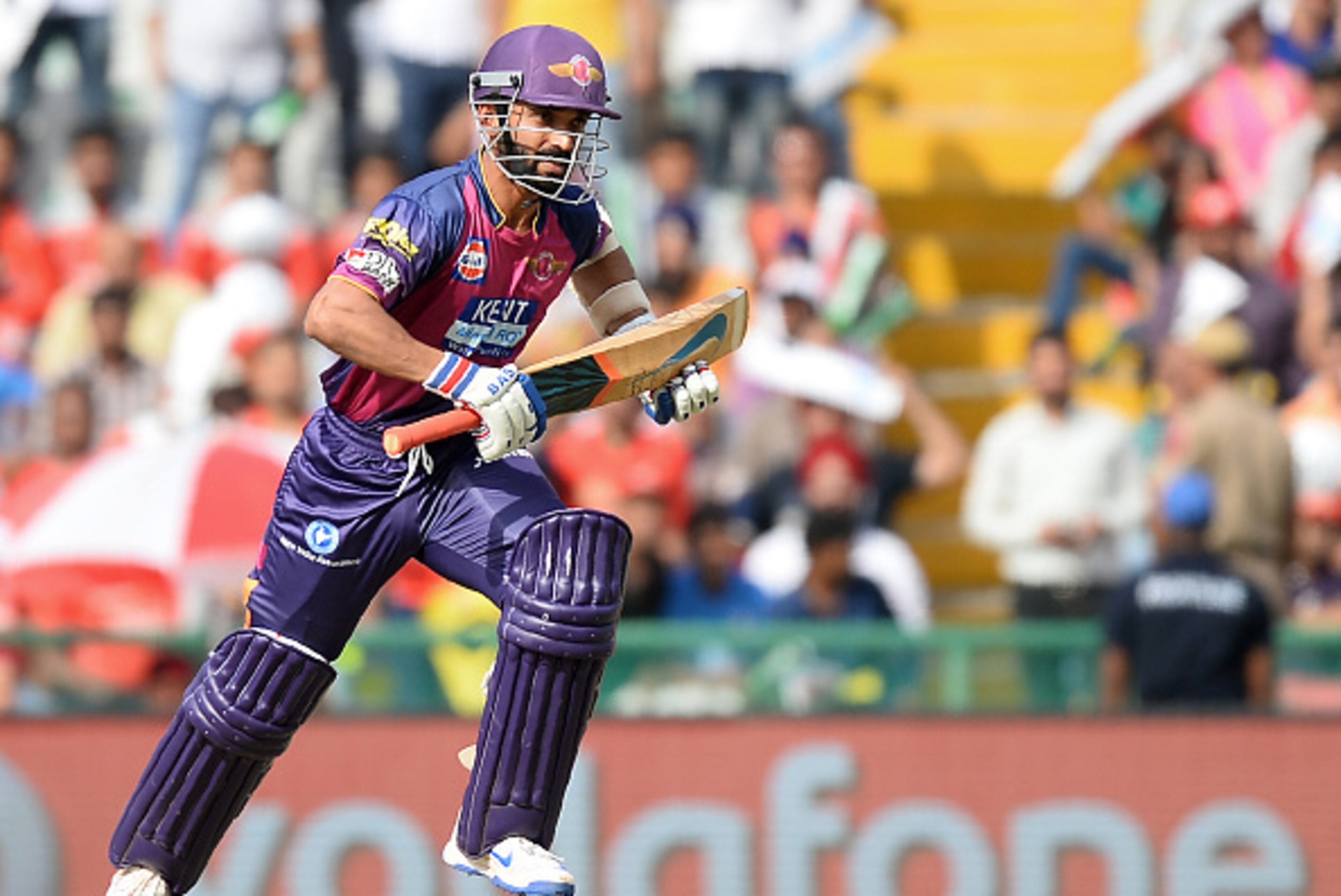 Rising Pune Supergiants batsman Ajinkya Rahane runs between the wickets during the 2016 Indian Premier League (IPL) Twenty20 cricket match between Rising Pune Supergiants and Kings XI Punjab at The Punjab Cricket Association Stadium in Mohali on April 17,