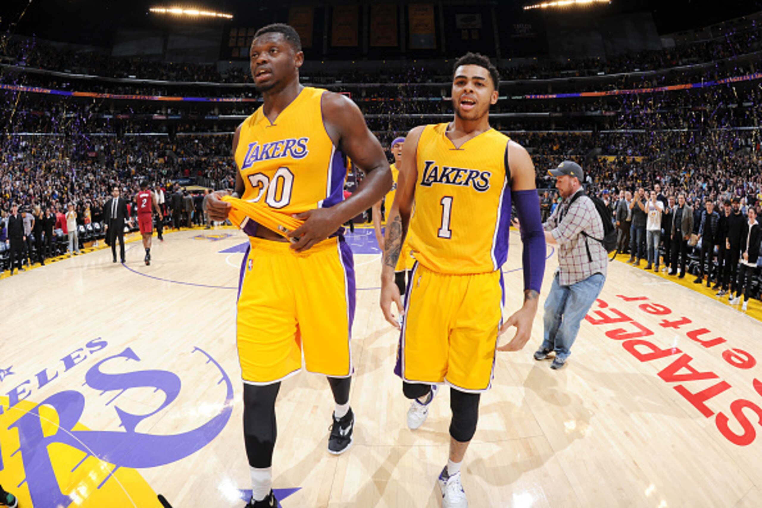 LOS ANGELES, CA - MARCH 30: Julius Randle #30 and D'Angelo Russell #1 of the Los Angeles Lakers celebrate an overtime win against the Miami Heat at STAPLES Center on March 30, 2016 in Los Angeles, California. NOTE TO USER: User expressly acknowledges and 