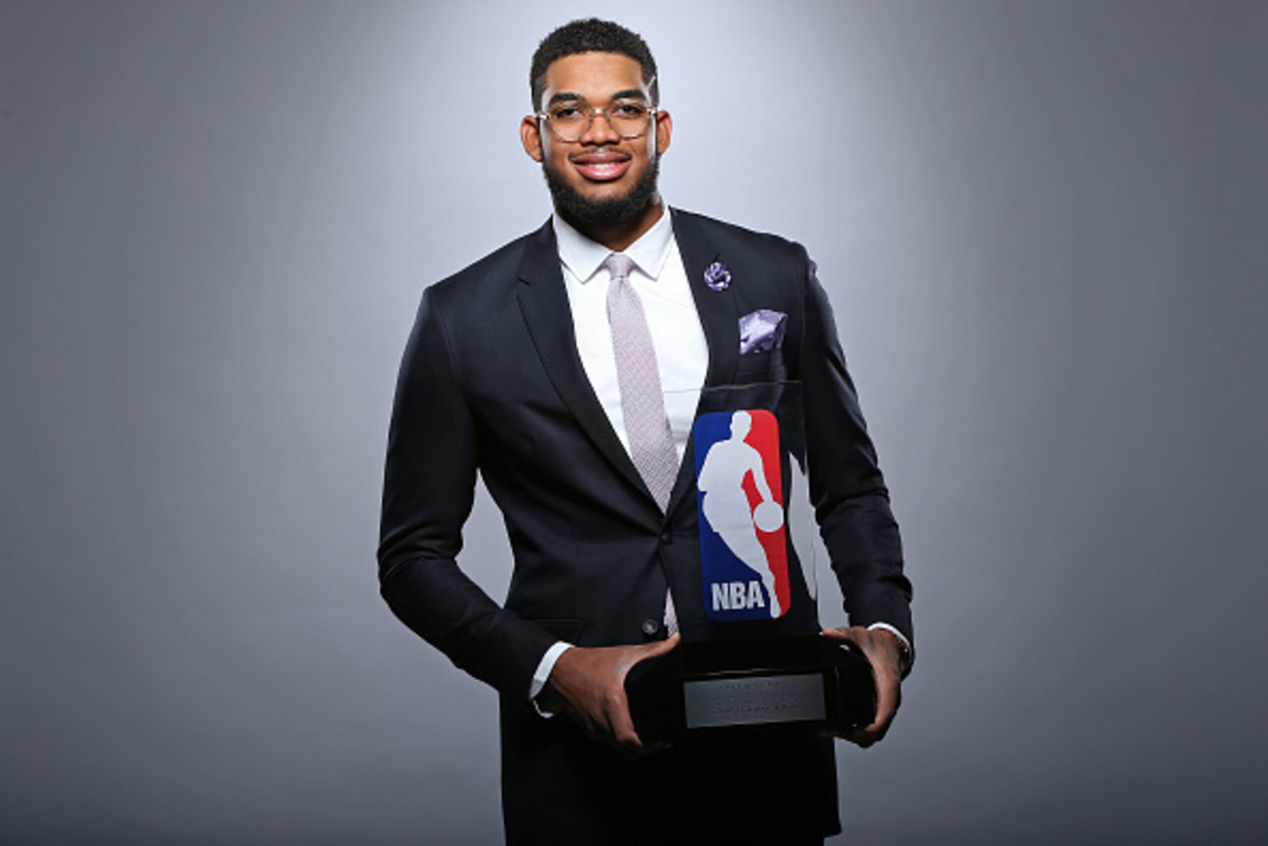 MINNEAPOLIS, MN - MAY 16: Karl-Anthony Towns #32 of the Minnesota Timberwolves poses with the Eddie Gottlieb trophy in preparation for his being named the 2015- 2016 Kia NBA Rookie of the Year on May 163, 2016 in Minneapolis, Minnesota. NOTE TO USER: Us MINNEAPOLIS, MN - MAY 16: Karl-Anthony Towns #32 of the Minnesota Timberwolves poses with the Eddie Gottlieb trophy in preparation for his being named the 2015- 2016 Kia NBA Rookie of the Year on May 163, 2016 in Minneapolis, Minnesota. NOTE TO USER: Us