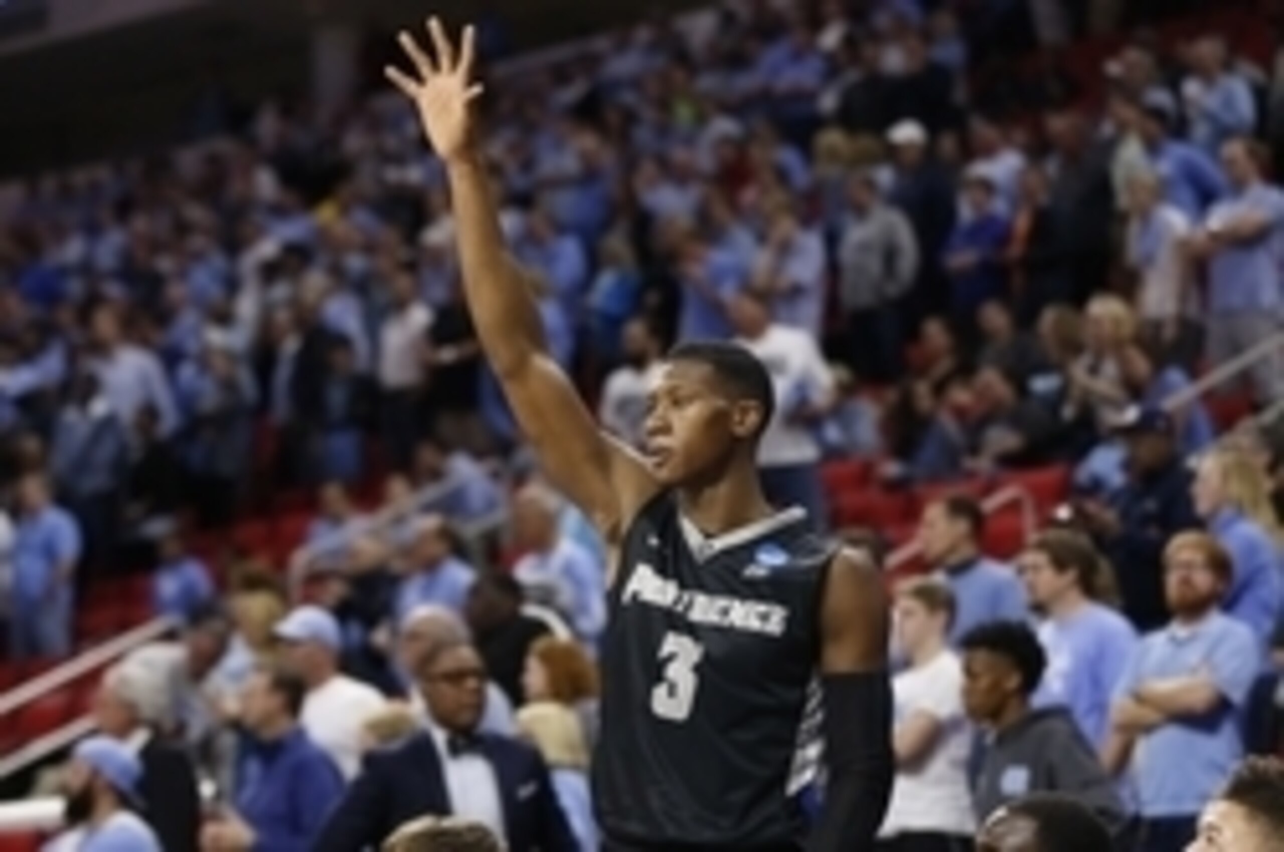 Mar 19, 2016; Raleigh, NC, USA; Providence Friars guard Kris Dunn (3) waves to the fans after being removed from the game against the North Carolina Tar Heels in the second half during the second round of the 2016 NCAA Tournament at PNC Arena. The Tar Hee