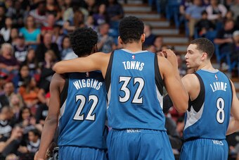 SACRAMENTO, CA - APRIL 7: Andrew Wiggins #22, Karl-Anthony Towns #32, and Zach LaVine #8 of the Minnesota Timberwolves look on during the game against the Sacramento Kings on April 7, 2016 at Sleep Train Arena in Sacramento, California. NOTE TO USER: User
