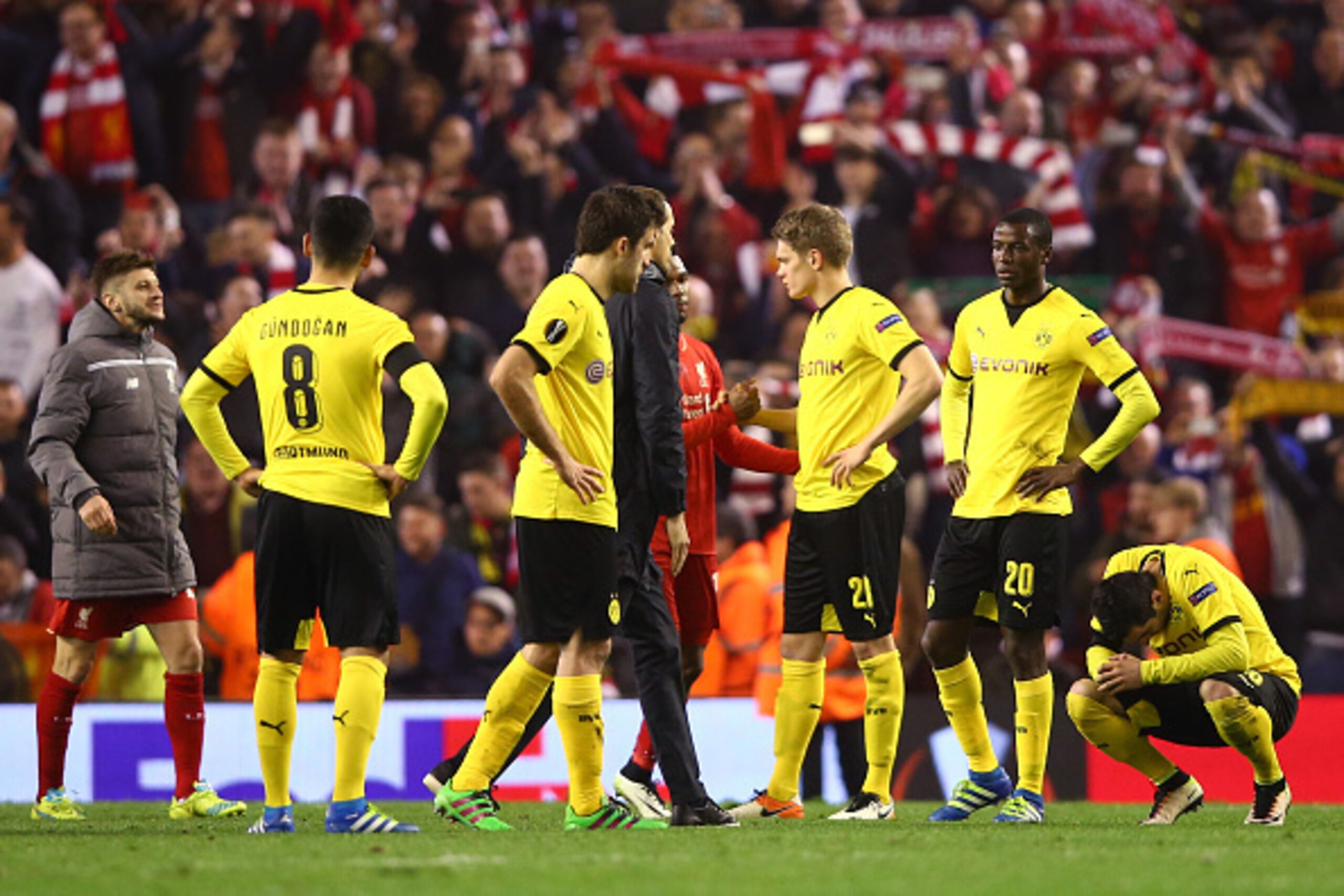 LIVERPOOL, ENGLAND - APRIL 14:  Dortmund players look dejected after the UEFA Europa League quarter final, second leg match between Liverpool and Borussia Dortmund at Anfield on April 14, 2016 in Liverpool, United Kingdom.  (Photo by Clive Brunskill/Getty