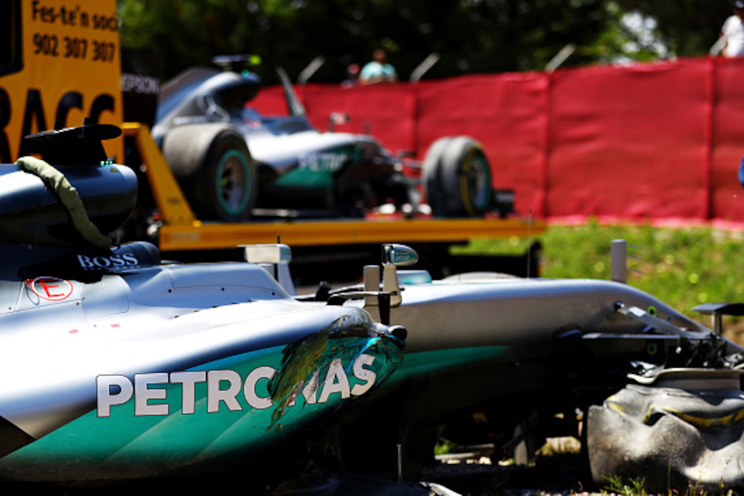 MONTMELO, SPAIN - MAY 15: The car of Lewis Hamilton of Great Britain and Mercedes GP at the side of the track, behind is the car of Nico Rosberg of Germany and Mercedes GP after they crashed together during the Spanish Formula One Grand Prix at Circuit de MONTMELO, SPAIN - MAY 15: The car of Lewis Hamilton of Great Britain and Mercedes GP at the side of the track, behind is the car of Nico Rosberg of Germany and Mercedes GP after they crashed together during the Spanish Formula One Grand Prix at Circuit de