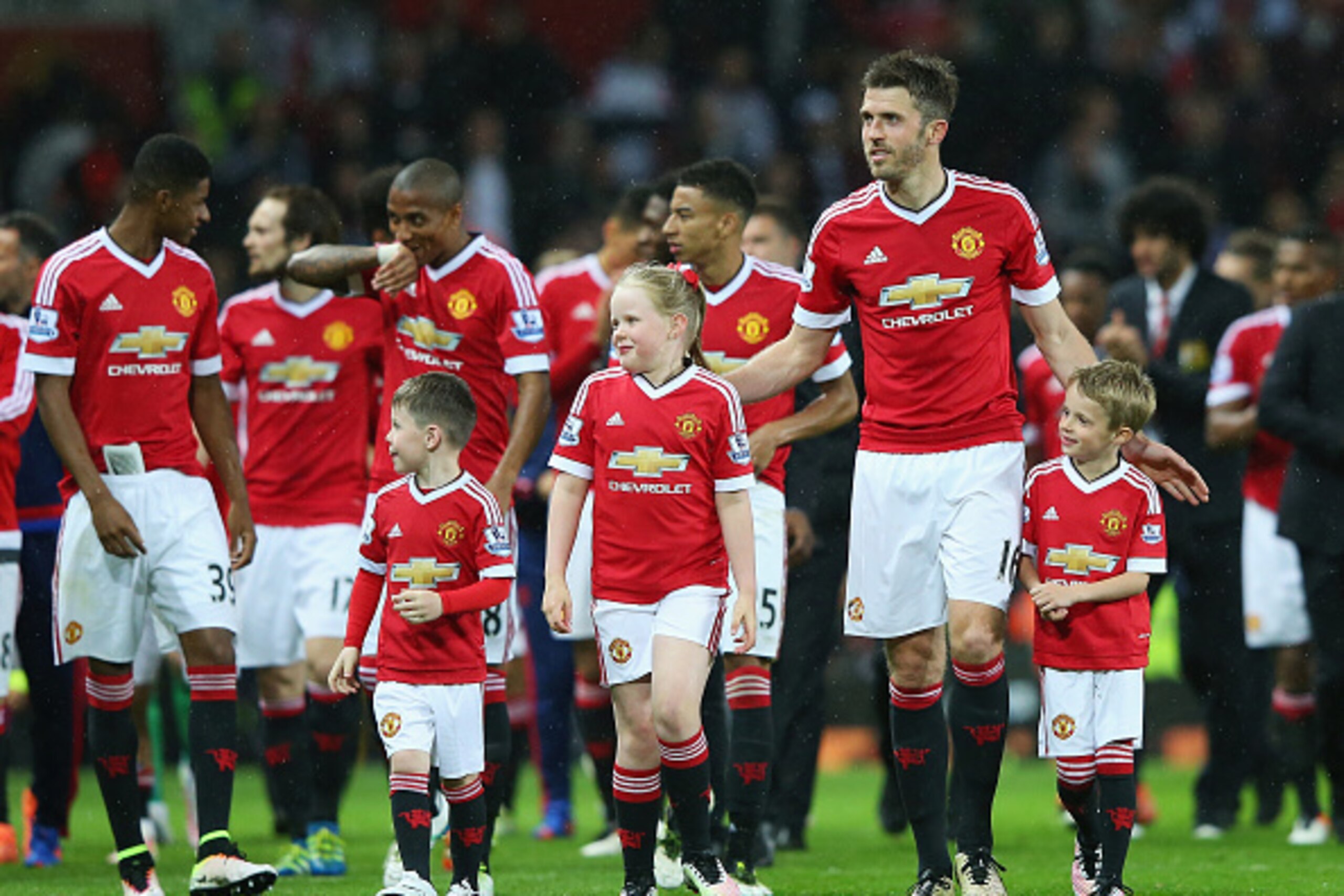 MANCHESTER, ENGLAND - MAY 17:  Michael Carrick of Manchester United and family walk around the pitch after the Barclays Premier League match between Manchester United and AFC Bournemouth at Old Trafford on May 17, 2016 in Manchester, England.  (Photo by A