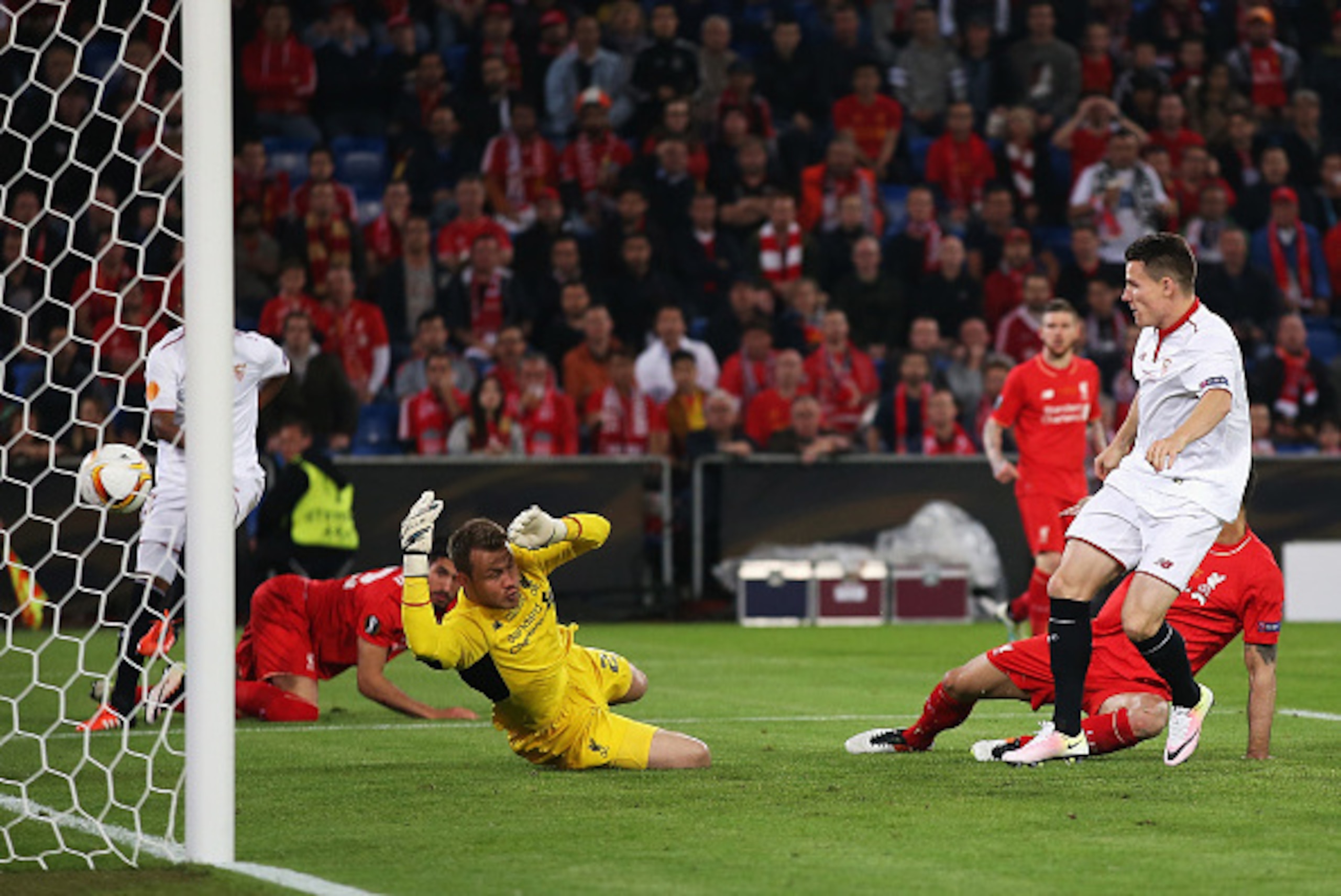 BASEL, SWITZERLAND - MAY 18:  Kevin Gameiro of Sevilla scores his team's first goal past Simon Mignolet of Liverpool during the UEFA Europa League Final match between Liverpool and Sevilla at St. Jakob-Park on May 18, 2016 in Basel, Switzerland.  (Photo b