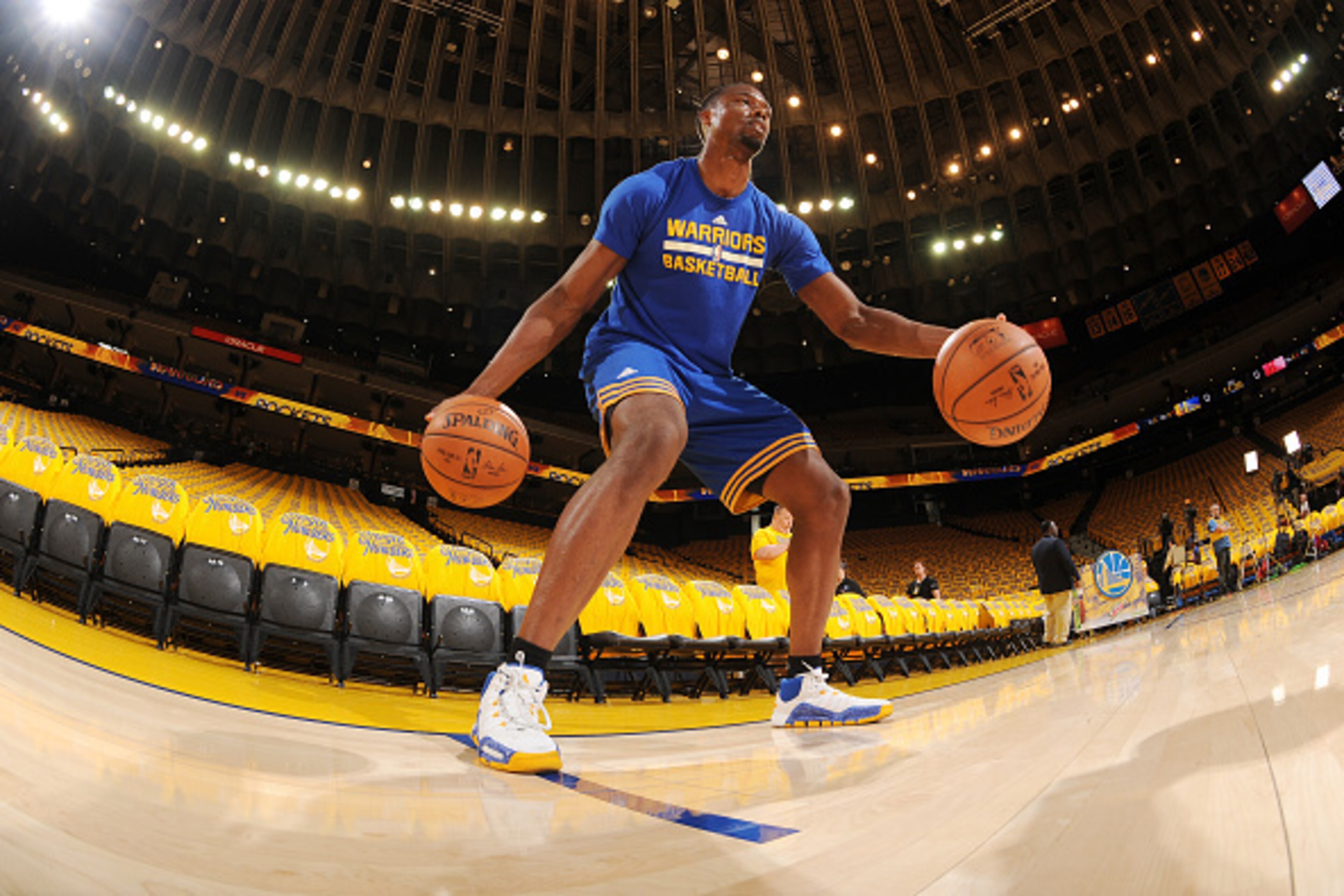 OAKLAND, CA - APRIL 18: Harrison Barnes #40 of the Golden State Warriors warms up before the game against the Houston Rockets in Game Two of the Western Conference Quarterfinals during the 2016 NBA Playoffs on April 18, 2016 at ORACLE Arena in Oakland, C OAKLAND, CA - APRIL 18: Harrison Barnes #40 of the Golden State Warriors warms up before the game against the Houston Rockets in Game Two of the Western Conference Quarterfinals during the 2016 NBA Playoffs on April 18, 2016 at ORACLE Arena in Oakland, C