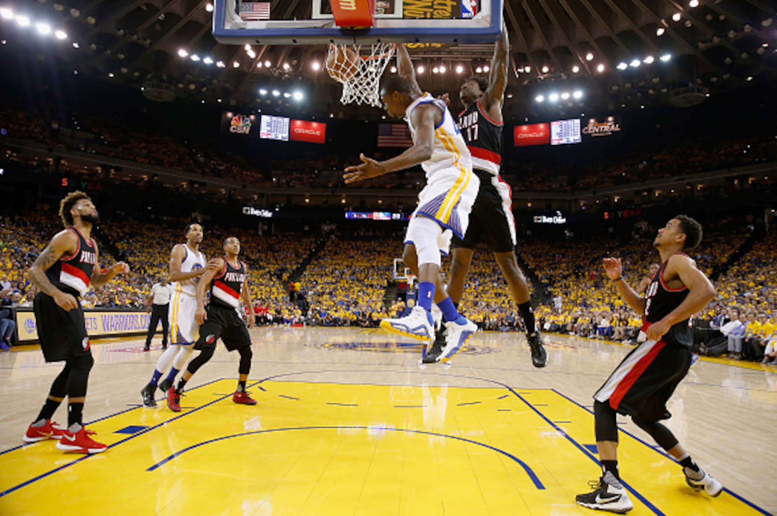 OAKLAND, CA - MAY 03:  Harrison Barnes #40 of the Golden State Warriors dunks on Ed Davis #17 of the Portland Trail Blazers during Game Two of the Western Conference Semifinals during the 2016 NBA Playoffs on May 3, 2016 at Oracle Arena in Oakland, Califo