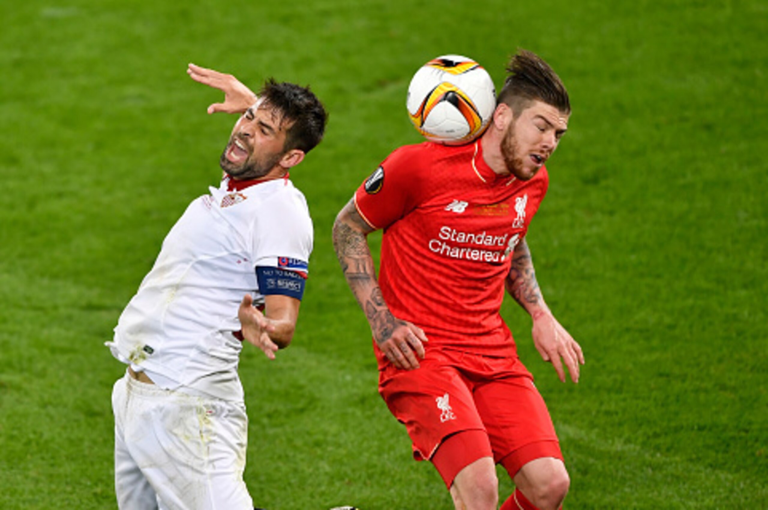 Sevilla's Spanish defender Coke (L) vies with Liverpool's Spanish defender Alberto Moreno during the UEFA Europa League final football match between Liverpool FC and Sevilla FC at the St Jakob-Park stadium in Basel, on May 18, 2016.  AFP PHOTO / FABRICE C