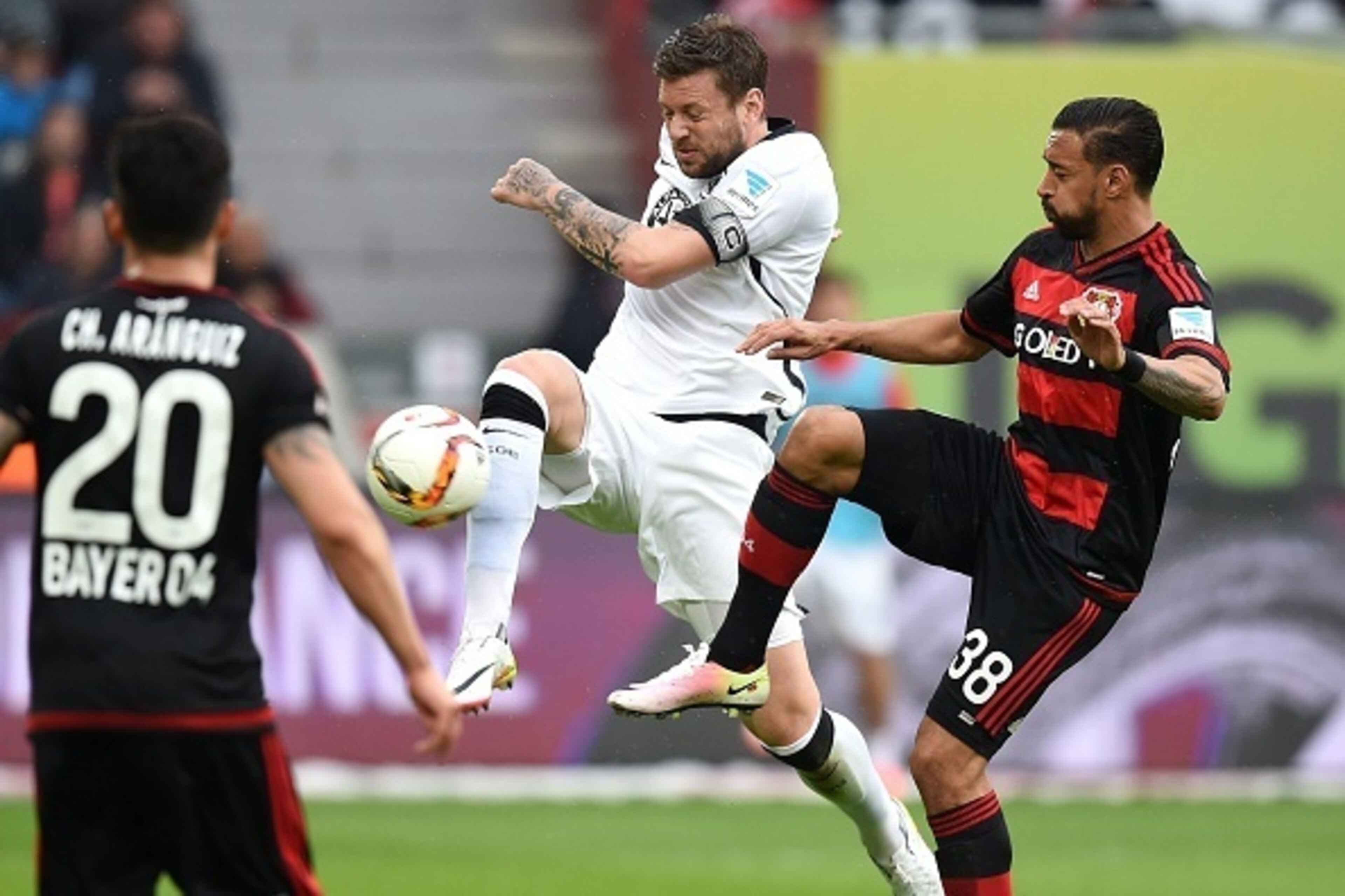 Frankfurt's defender Marco Russ and Leverkusen's midfielder Karim Bellarabi (R) vie for the ball during the German first division Bundesliga football match Bayer 04 Leverkusen vs Eintracht Frankfurt in Leverkusen, western Germany, on April 16, 2016. / AFP Frankfurt's defender Marco Russ and Leverkusen's midfielder Karim Bellarabi (R) vie for the ball during the German first division Bundesliga football match Bayer 04 Leverkusen vs Eintracht Frankfurt in Leverkusen, western Germany, on April 16, 2016. / AFP