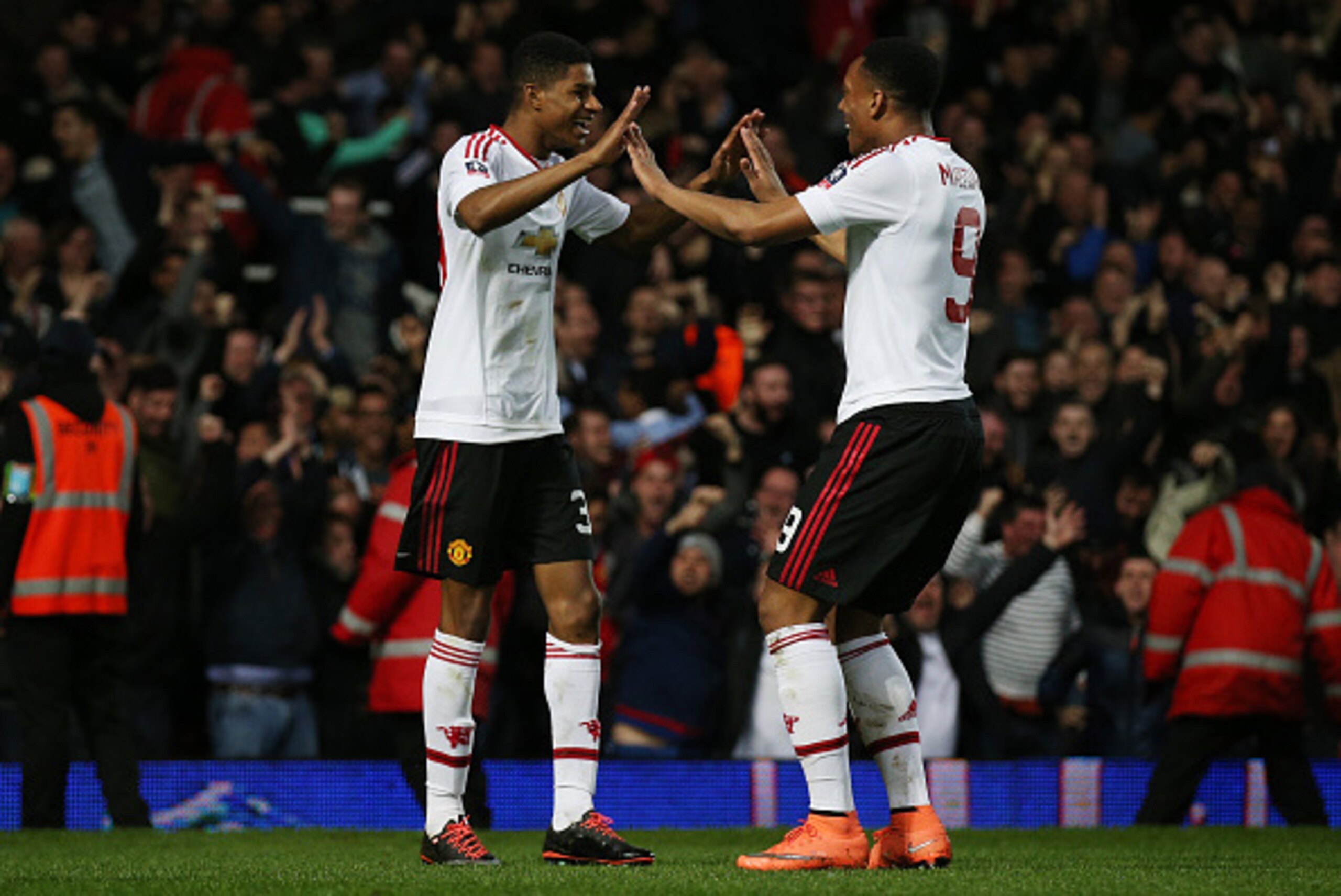 LONDON, ENGLAND - APRIL 13:  Marcus Rashford of Manchester United celebrates scoring the opening goal with Anthony Martial of Manchester United during The Emirates FA Cup, sixth round replay between West Ham United and Manchester United at the Boleyn Grou