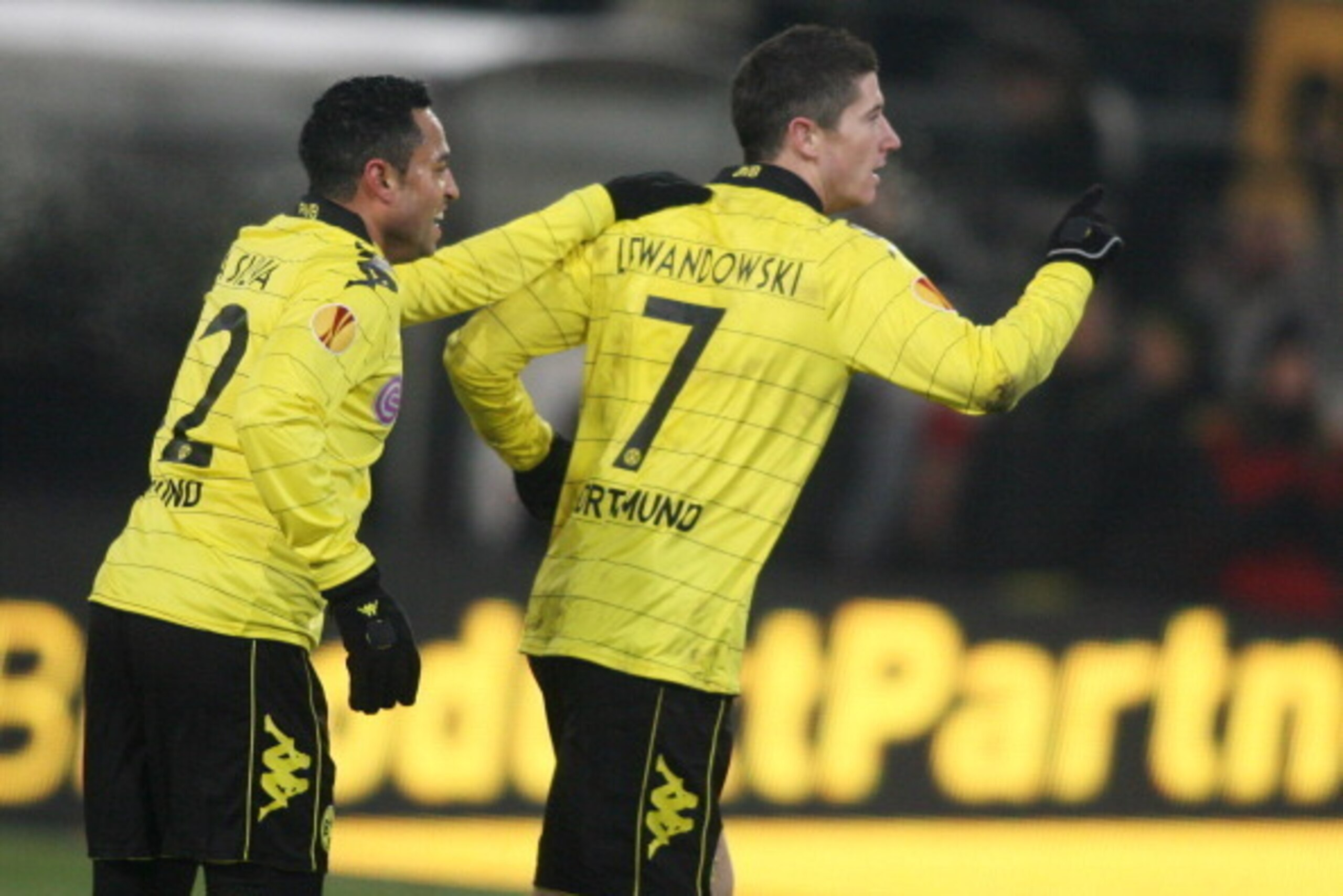 Dortmund`s Antonio da Silva (L) and Robert Lewandowski celebrate after the 3-0 goal during the Europa League football match of Borussia Dortmund (Germany) against Karpaty Lviv (Ukraine) in Dortmund, western Germany, on December 2, 2010. Dortmund won 3 - 0