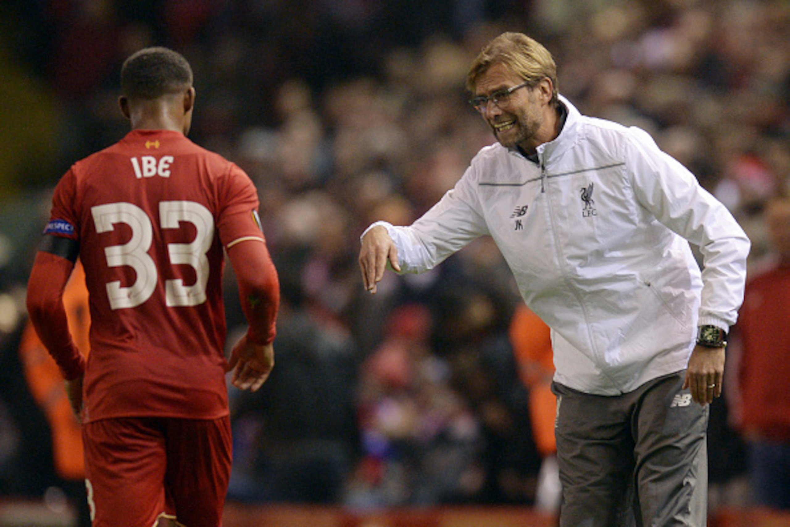Liverpool's German manager Jurgen Klopp (R) talks with Liverpool's English midfielder Jordon Ibe during a UEFA Europa League group B football match between Liverpool and Bordeaux at Anfield in Liverpool, north west England, on November 26, 2015. AFP PHOTO