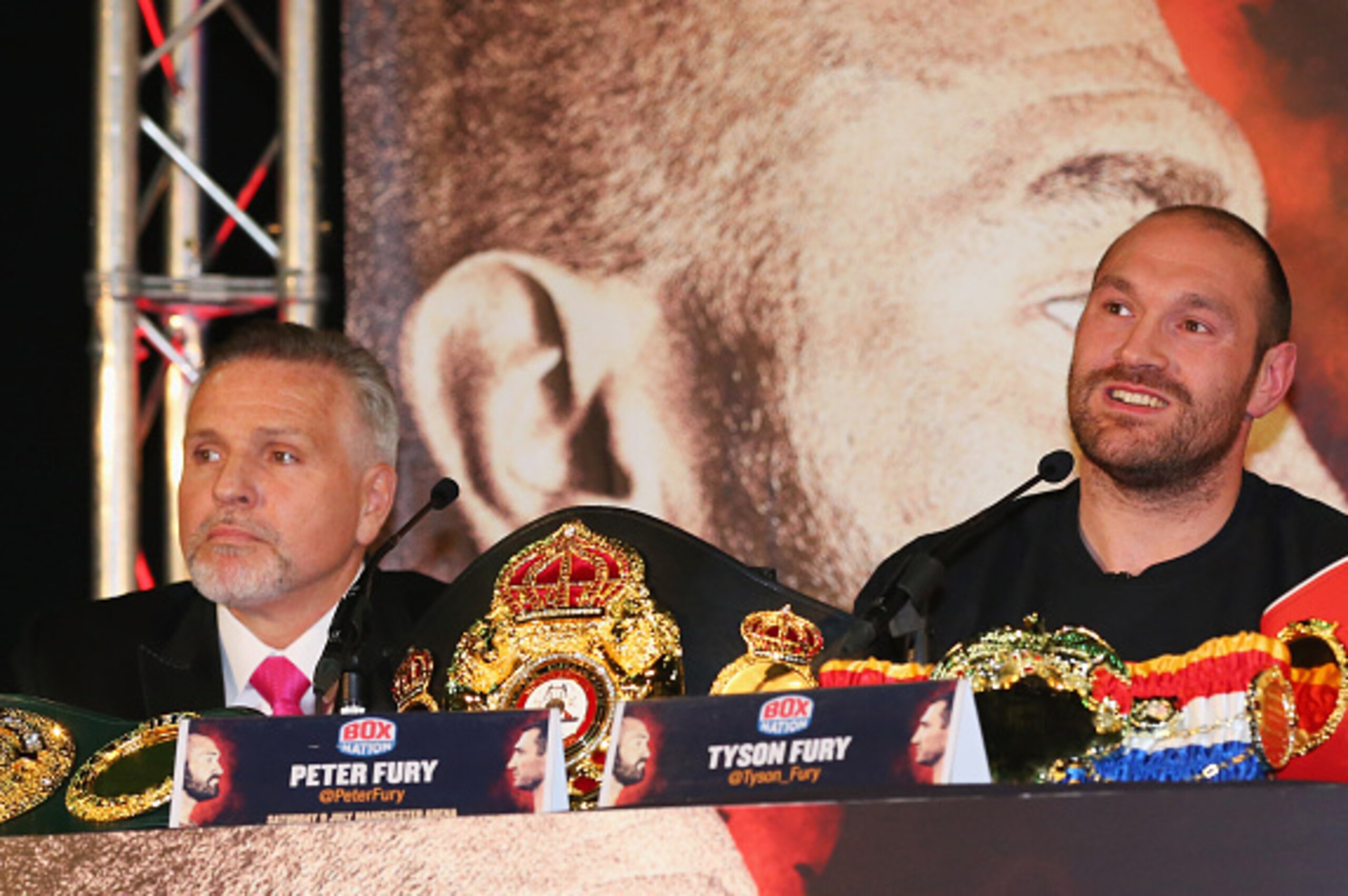 MANCHESTER, ENGLAND - APRIL 27:  Reigning WBO, WBA and IBO heavyweight champion Tyson Fury looks on alongside trainer and uncle Peter Fury during Tyson Fury and Wladimir Klitschko head to head press conference at Manchester Arena on April 27, 2016 in Manc