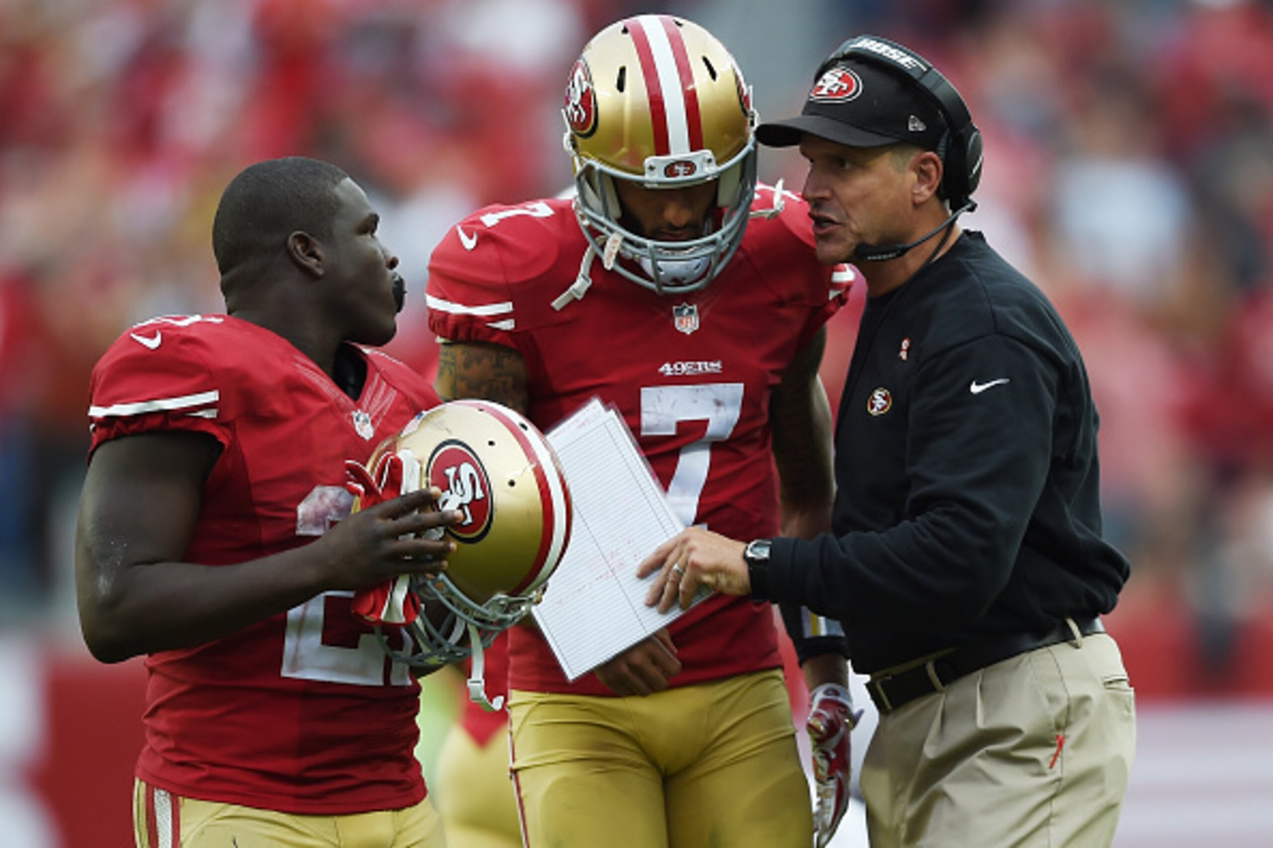 SANTA CLARA, CA - SEPTEMBER 28: Head Coach Jim Harbaugh of the San Francisco 49ers talks with quarterback Colin Kaepernick #7 and running back Frank Gore #21 during a time out against the Philadelphia Eagles during the fourth quarter at Levi's Stadium on SANTA CLARA, CA - SEPTEMBER 28: Head Coach Jim Harbaugh of the San Francisco 49ers talks with quarterback Colin Kaepernick #7 and running back Frank Gore #21 during a time out against the Philadelphia Eagles during the fourth quarter at Levi's Stadium on