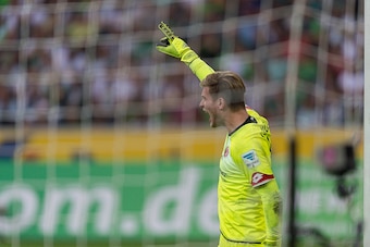 MOENCHENGLADBACH, GERMANY - AUGUST 23: Loris Karius (1) of FSV Mainz 05 directing his team into position for the upcoming free-kick at Borussia Park on August 23, 2015 in Moenchengladbach, Germany.  (Photo by Oliver Kremer at Pixolli Studios/Getty Images)