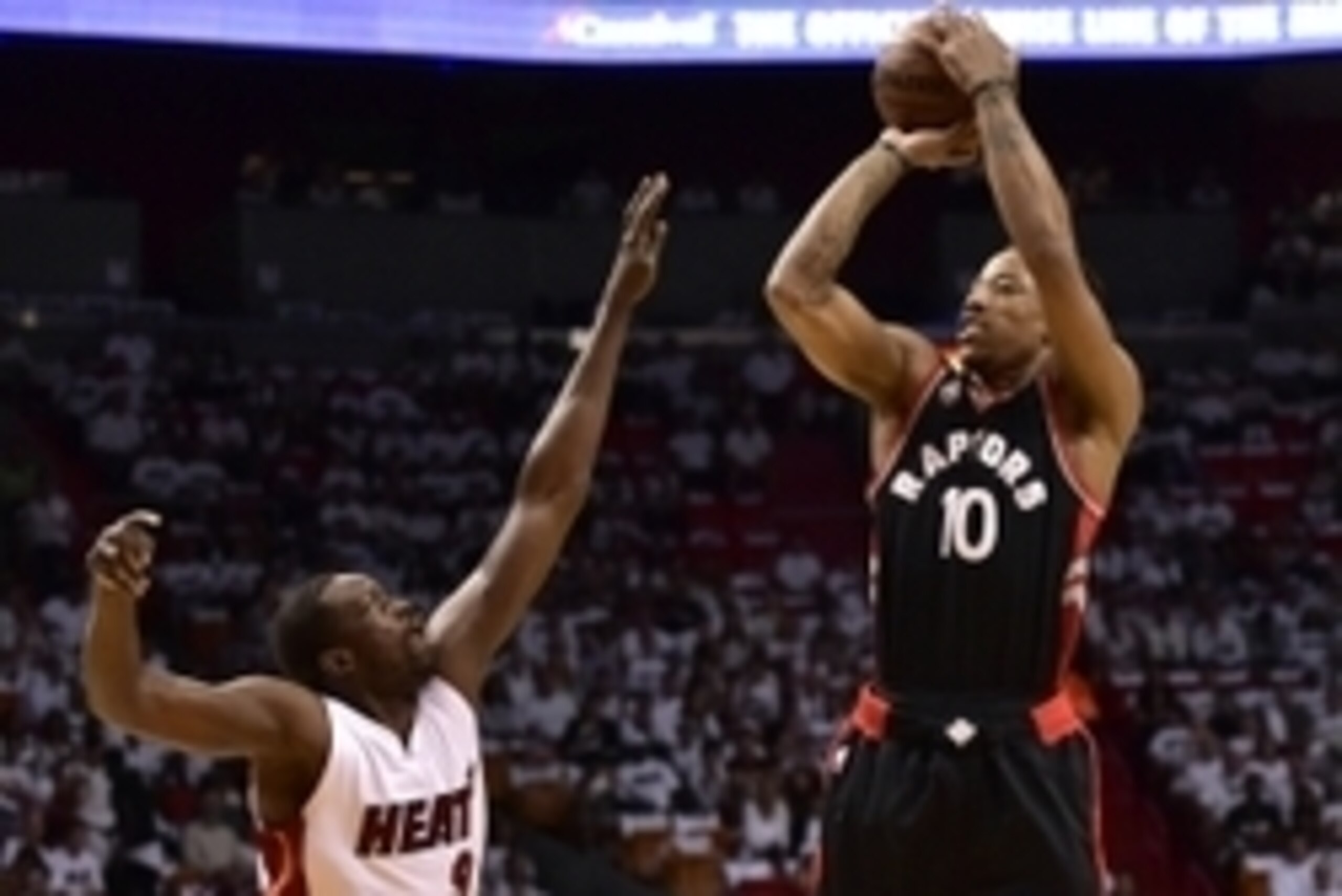 May 7, 2016; Miami, FL, USA; Toronto Raptors guard DeMar DeRozan (10) shoots over Miami Heat forward Luol Deng (9) during the first quarter in game three of the second round of the NBA Playoffs at American Airlines Arena. Mandatory Credit: Steve Mitchell-
