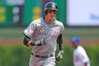 Jul 3, 2015; Chicago, IL, USA; Miami Marlins left fielder Christian Yelich (21) runs the bases after hitting a home run during the first inning against the Chicago Cubs  at Wrigley Field. Mandatory Credit: Dennis Wierzbicki-USA TODAY Sports