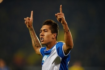 Hoffenheim's Brazilian midfielder Roberto Firmino celebrates during the German Football Cup DFB Pokal quarter-final match between Borussia Dortmund and 1899 Hoffenheim in Dortmund, western Germany, on April 7, 2015. AFP PHOTO / PATRIK STOLLARZ  DFB RULES 