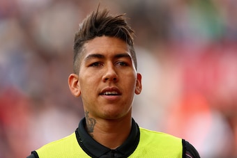STOKE ON TRENT, ENGLAND - AUGUST 09:  Roberto Firmino of Liverpool starts on the substitutes bench during the Barclays Premier League match between Stoke City and Liverpool at Britannia Stadium on August 9, 2015 in Stoke on Trent, England.  (Photo by Cliv
