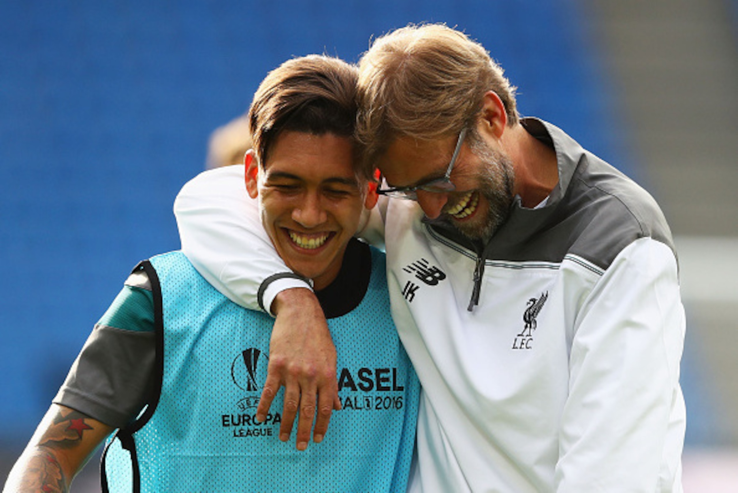 BASEL, SWITZERLAND - MAY 17: Roberto Firmino of Liverpool laughs with manager Jurgen Klopp during a Liverpool training session on the eve of the UEFA Europa League Final against Sevilla at St. Jakob-Park on May 17, 2016 in Basel, Switzerland.  (Photo by M