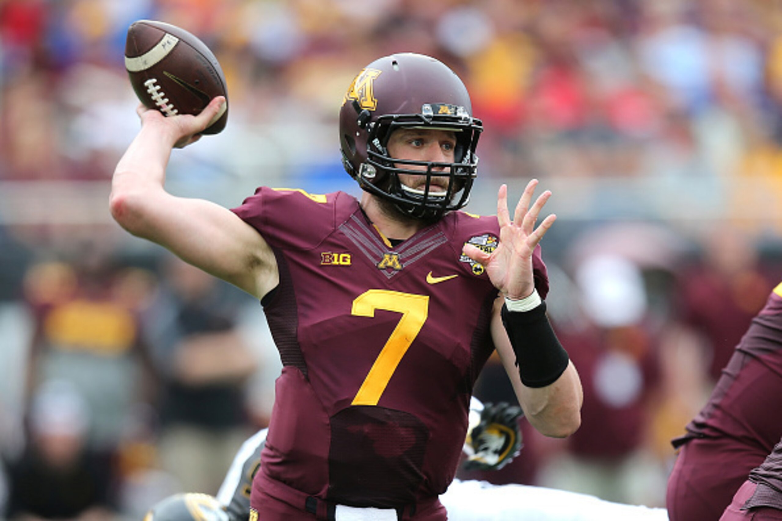ORLANDO, FL - JANUARY 01: Mitch Leidner #7 of the Minnesota Golden Gophers throws a pass during the Buffalo Wild Wings Citrus Bowl against the Missouri Tigers at the Florida Citrus Bowl on January 1, 2015 in Orlando, Florida. (Photo by Alex Menendez/Getty