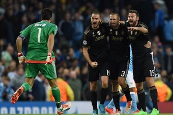(L-R) Juventus' goalkeeper from Italy Gianluigi Buffon, Juventus' defender from Italy Leonardo Bonucci, Juventus' defender from Italy Giorgio Chiellini and Juventus' defender from Italy Andrea Barzagli celebrate after winning a UEFA Champions League group