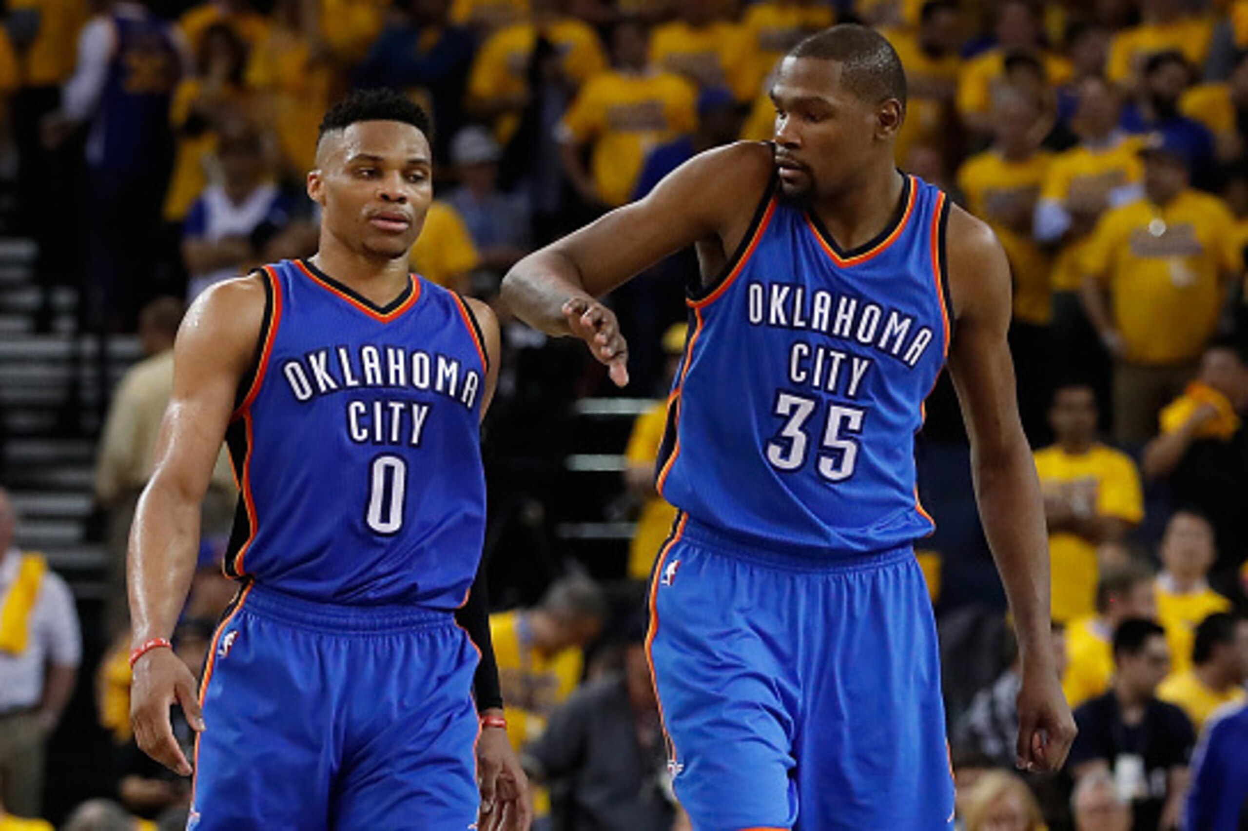 OAKLAND, CA - MAY 16:  Kevin Durant #35 (R) of the Oklahoma City Thunder celebrates with Russell Westbrook #0 during the final moments of game one of the NBA Western Conference Finals against the Golden State Warriors at ORACLE Arena on May 16, 2016 in Oa