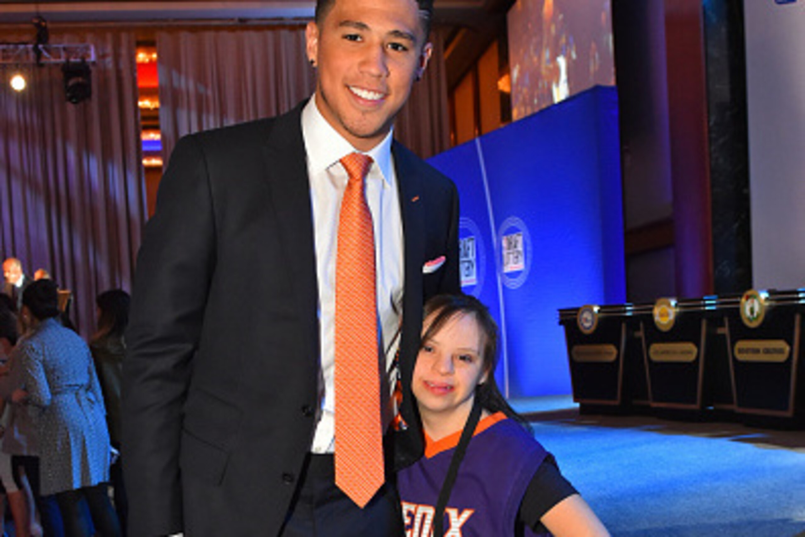 NEW YORK, NEW YORK - MAY 17: Devin Booker #1 of the Phoenix Suns poses for a photo with Phoenix Suns fan, Jenna Warren during the 2016 NBA Draft Lottery at the New York Hilton in New York, New York. NOTE TO USER: User expressly acknowledges and agrees th NEW YORK, NEW YORK - MAY 17: Devin Booker #1 of the Phoenix Suns poses for a photo with Phoenix Suns fan, Jenna Warren during the 2016 NBA Draft Lottery at the New York Hilton in New York, New York. NOTE TO USER: User expressly acknowledges and agrees th